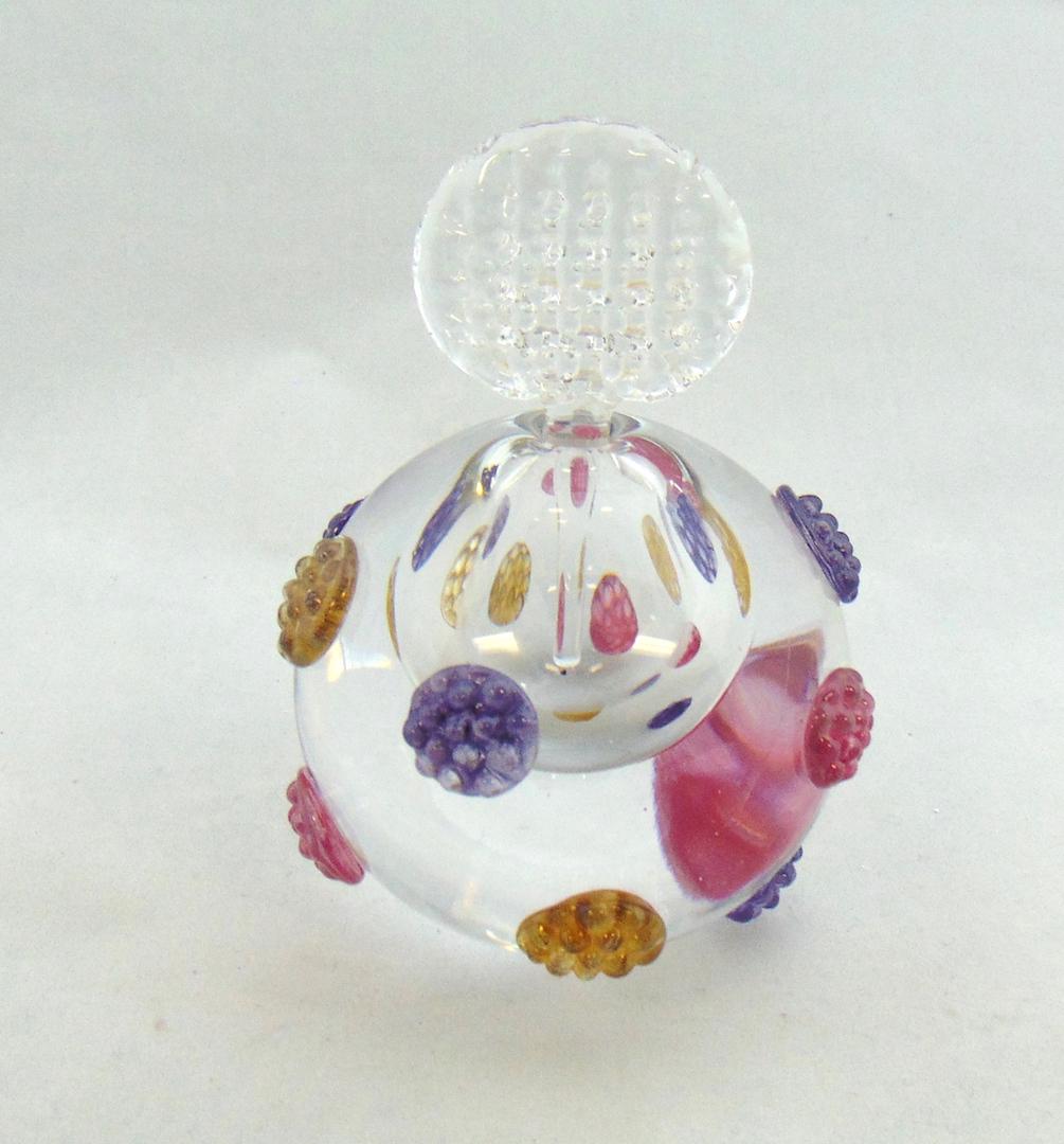 Leon Applebaum glass perfume: Orb form in translucent glass decorated with purple, red, and yellow raspberry prunts, signed Leon Applebaum, 5 1/2" ht. Condition: good with no defects found.