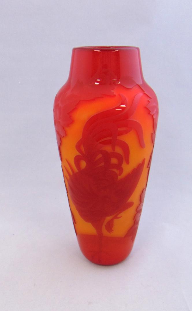 Valerie Surjan cameo glass vase: Cylindrical form in Cherry red glass cut back to a lemon yellow with fighting rooster, has original papers, signed Valerie Surjan Nourot VS 103-82, 10" ht. Condition: good with no defects found.