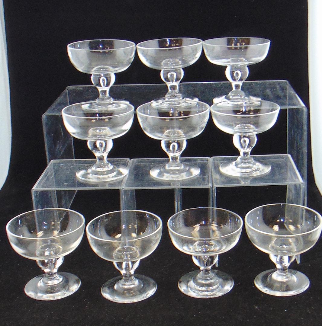 10 Steuben clear glass parfaits: Footed parfaits with a tear drop standard, signed Steuben 3 3/4' ht. Condition: good with no defects found.