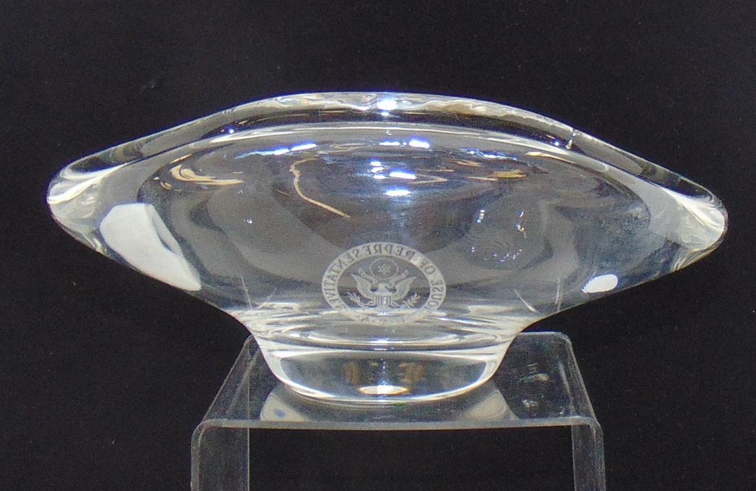 House of Representatives crystal bowl: Large oblong blow in heavy crystal glass adorn with the seal of the House of Representatives, attributed to Steuben, 11" long by 5" ht. Condition: good with no defects found.