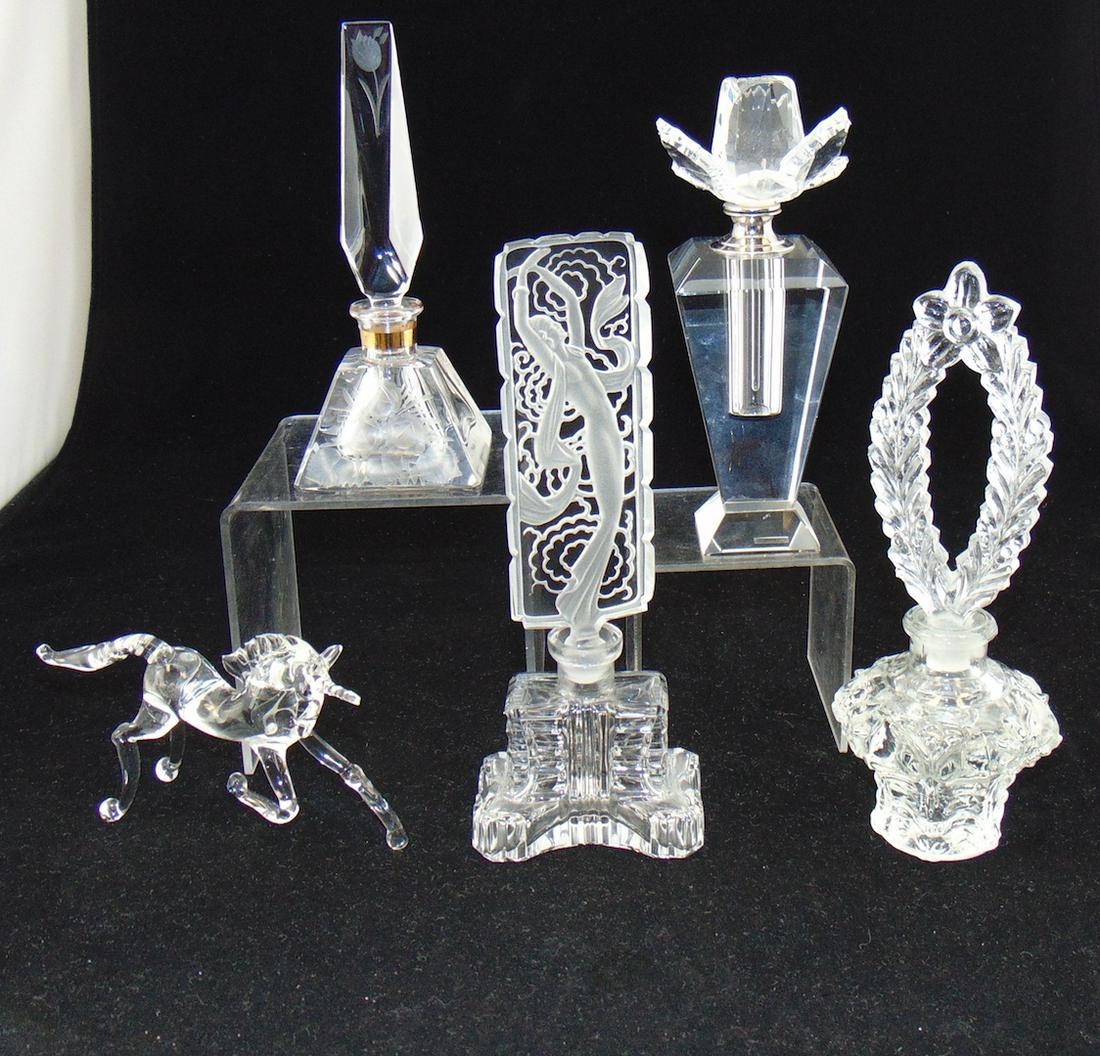 Czech perfumes and more: Including a block faceted perfume with rose finial a faceted perfume with etched flowers a glass unicorn and two Czech perfumes one with an Art Nouveau lady, tallest 7 1/2' ht. Condition: good with no