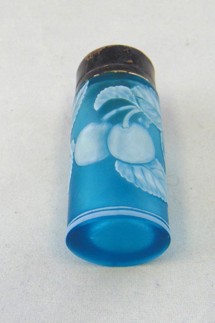 Thomas Webb blue cameo perfume: Cylindrical form in Prussian blue decorated with a leafy branch of apples, 2 3/4" ht. Condition: good with no defects found.