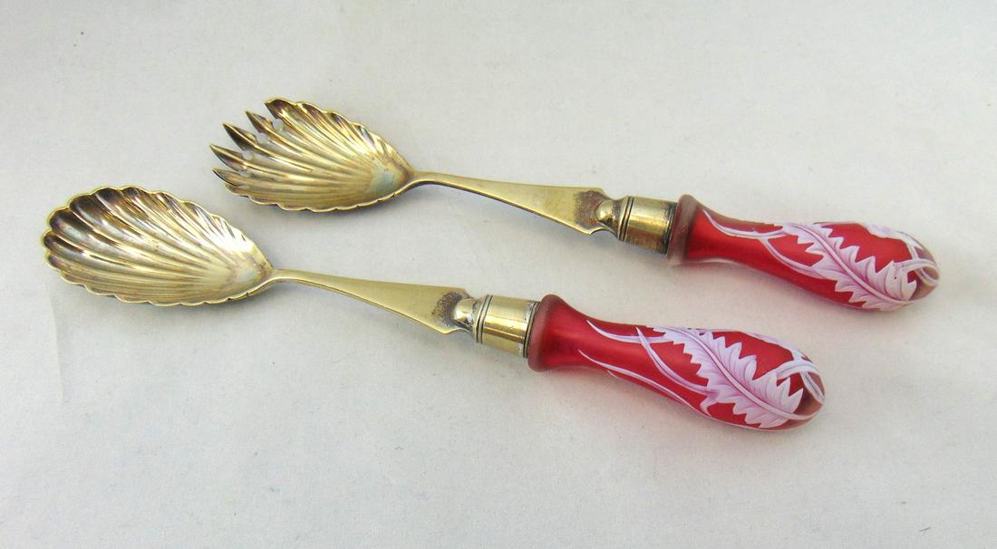 Thomas Webb cameo salad set: English hallmark serving set with Thomas Webb and Sons red cameo carved handles, 10 1/2" long. Condition: good with no defects found.
