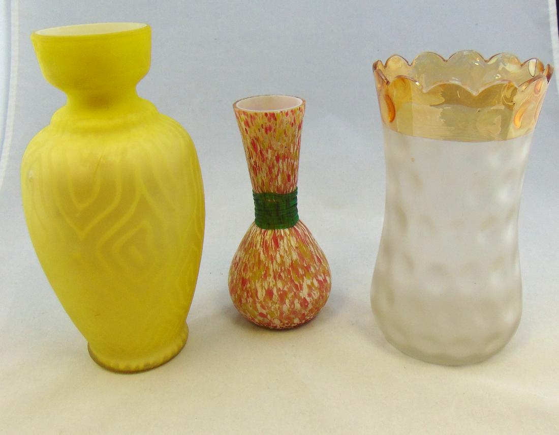 Three piece grouping of Victorian glass: Including a yellow MOP vase in the moire pattern, a Midwest Pomona celery and a red and yellow spatter ware with green threading, tallest 8 1/2" ht. Condition: 1 1/2" outer casing crack and bump on th