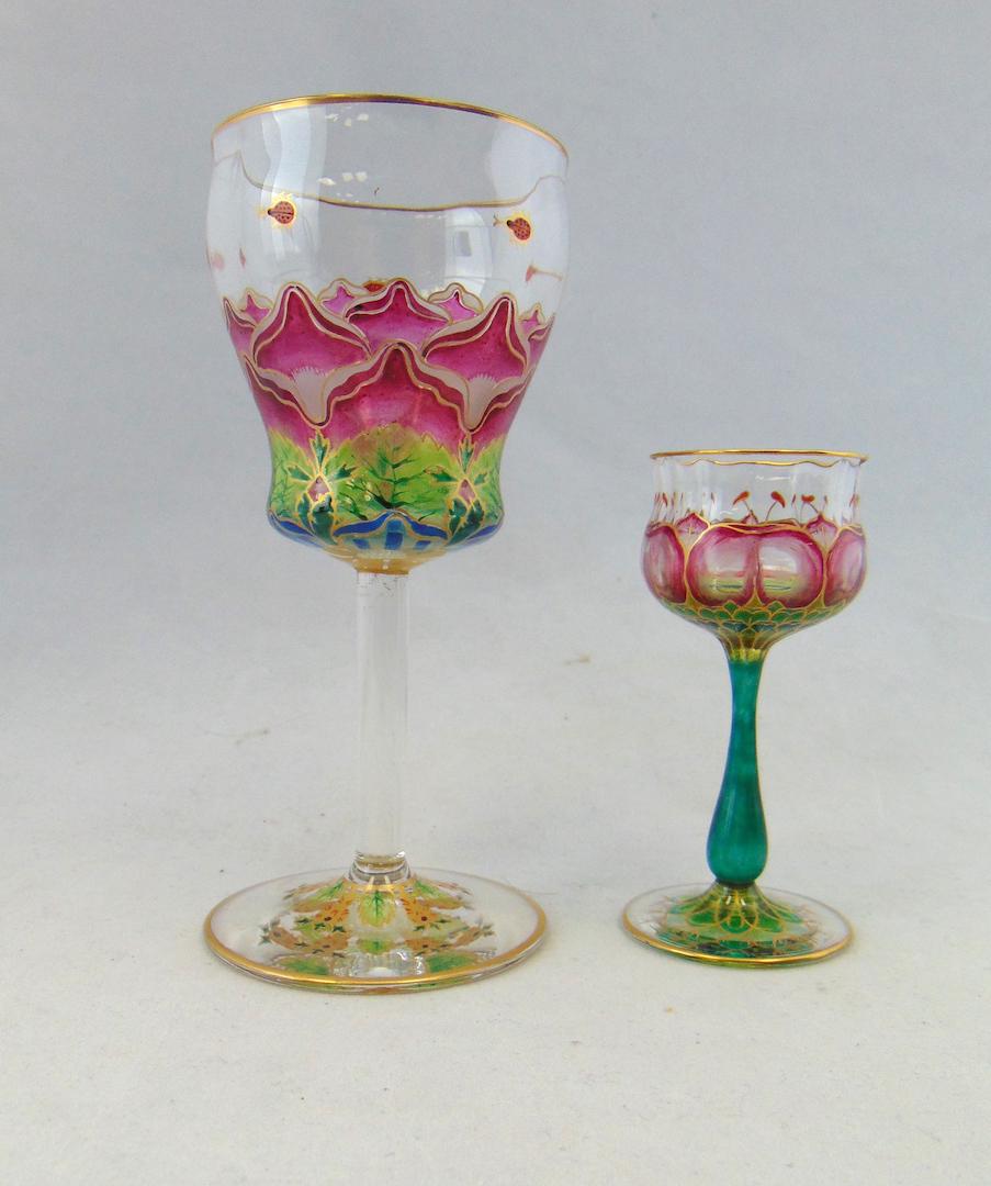Meyrs Neff translucent glass goblets: White wine goblet in clear glass decorated with translucent enamel in an Art Nouveau pattern, together with a similar designed cordial, 5 1/2' ht. Condition: good with no defects found.