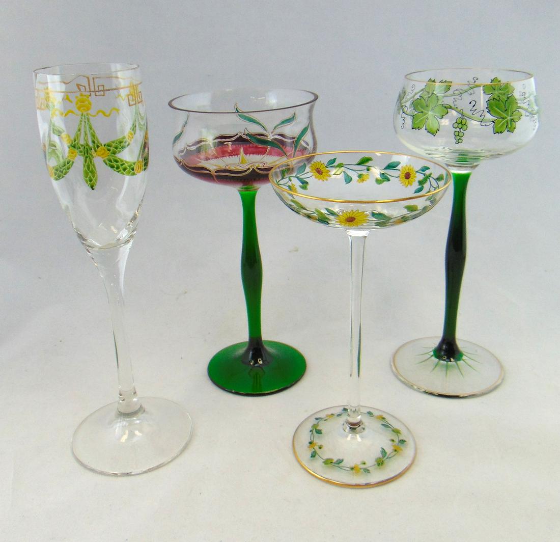 Four Theresienthaler glass goblets: Two green stemmed Theresienthaler goblets one with enameled grapes and one in an Art Nouveau design, together with a swirled Champaign with green swags and an attributed stem with sunflowers, tallest 