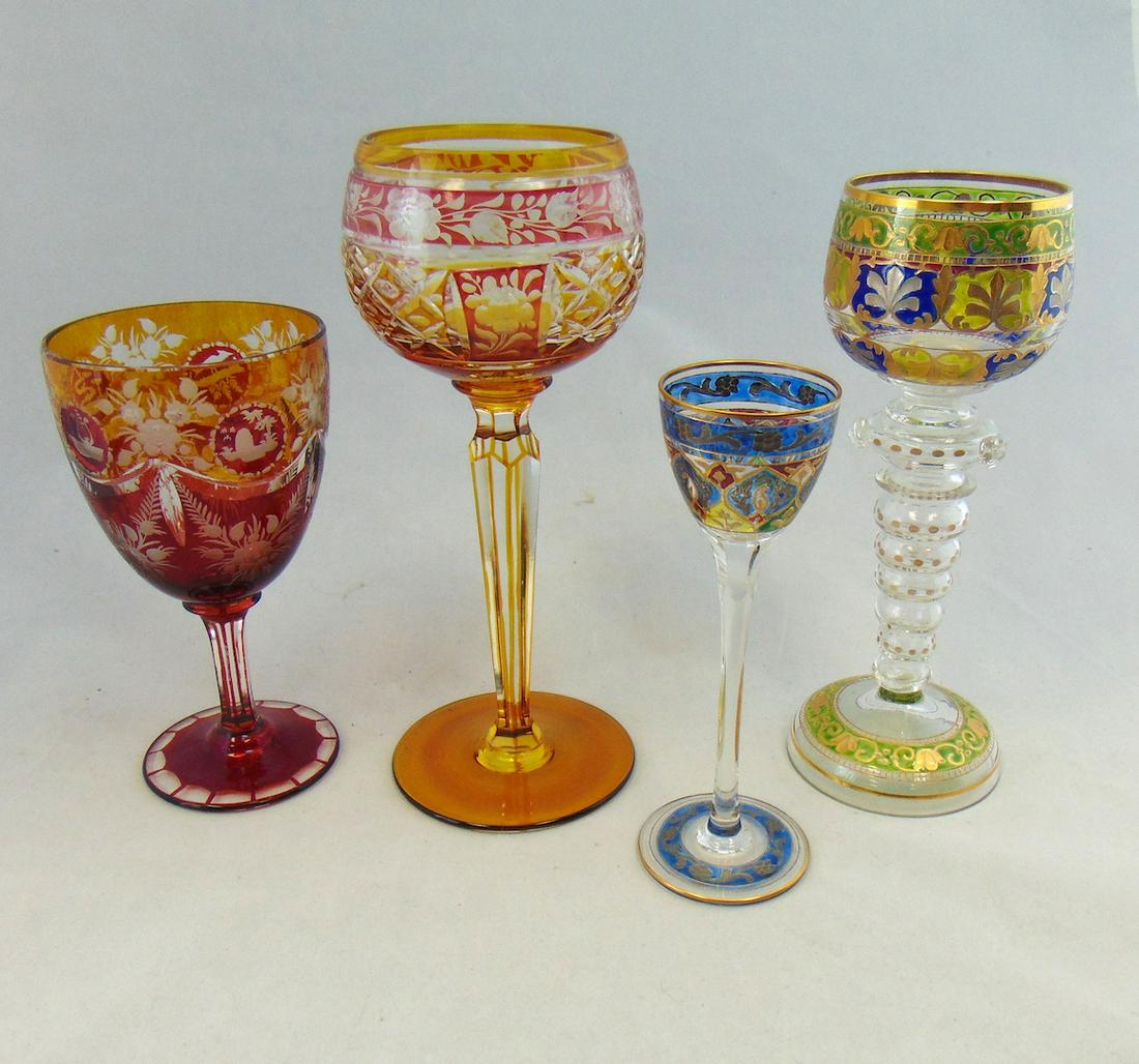 Four Bohemian glass goblets: Including a heavy enamel Fritz Heckert Roemer and a Fritz Heckert cordial, together with two ruby and amber cut to clear goblets, 8" ht. Condition: good with no defects found