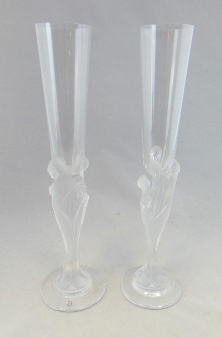 Pair of Erte Majestique flutes: Tall Majestique flutes with frosted figural women, marked Erte France, 11 3/4' ht. Condition: good with no defects found.