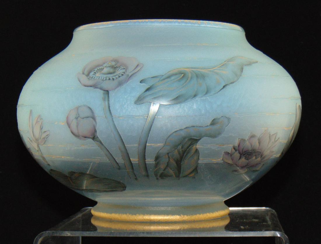 Daum Nancy French cameo bowl: Large opalescent blue bowl decorated with pink water lilies on gray leaves with gold accents, signed in gold Daum Nancy, 8" wide by 5 1/2" ht. Condition: good with no defects found.