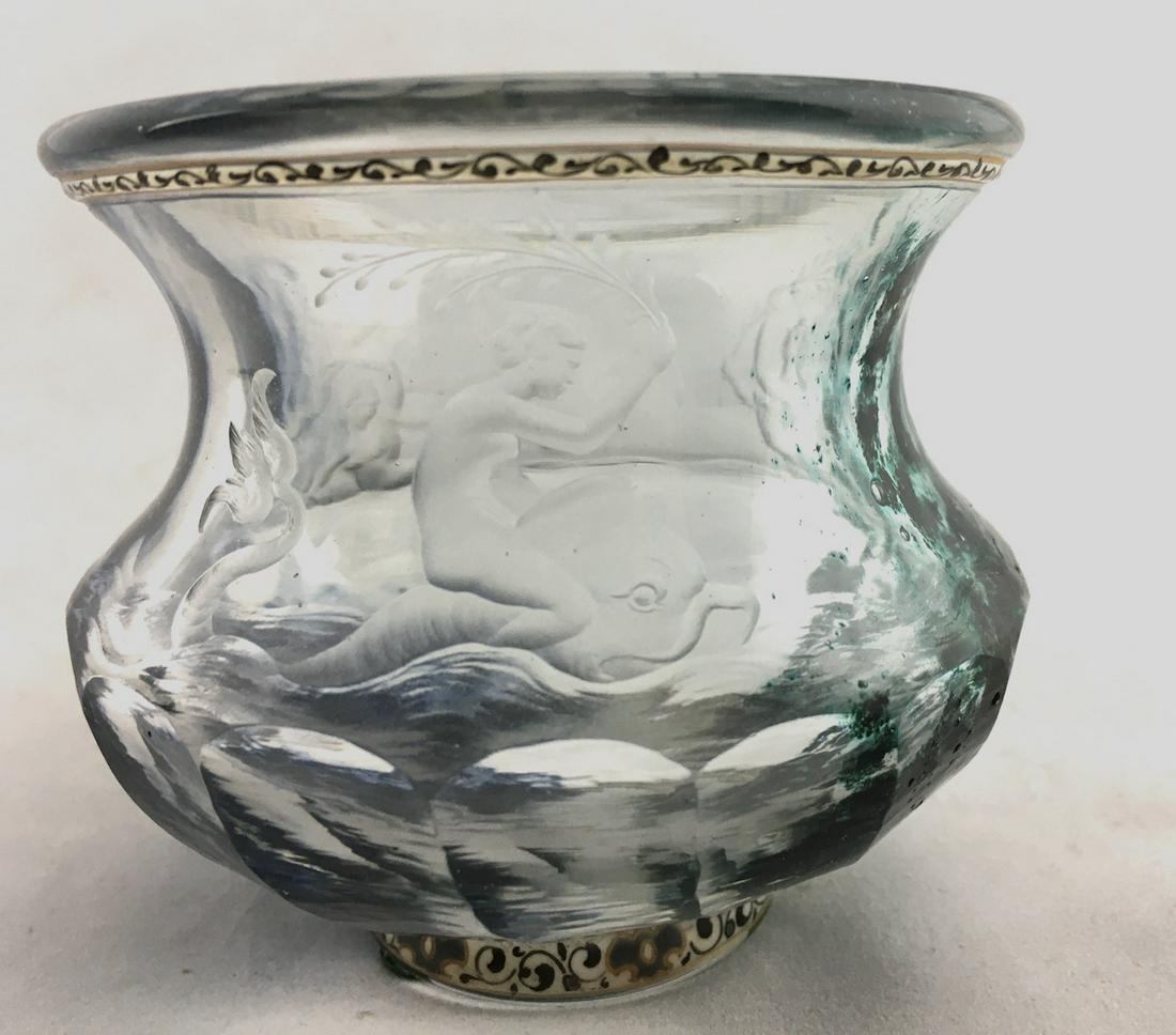 Galle French engraved glass vase: Urn form translucent glass vase with black and blue metallic oxide inclusions etched with the mythological nude riding a dolphin the back etched with two nudes and dolphin, accented with a black scrol