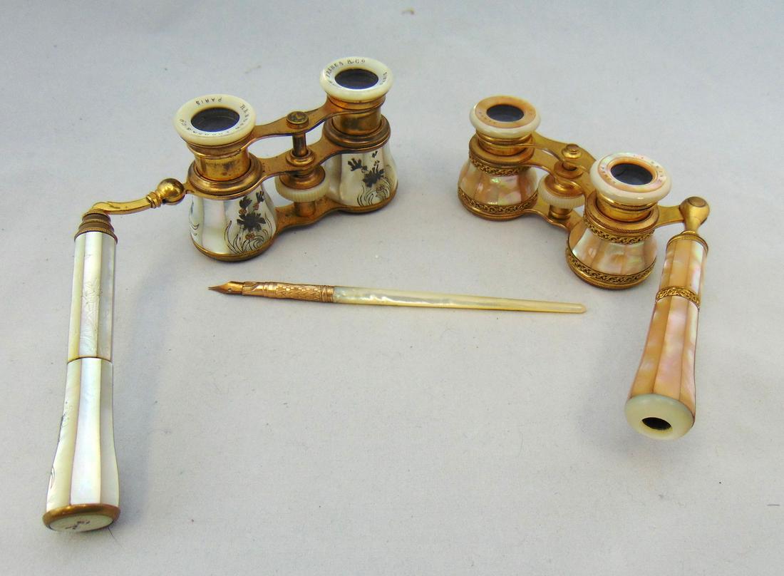 Three Mother of Pearl items: Including a writing pen with 14K marked tip, and two working opera binoculars, one marked Flammarion, longest 9" long. Condition: minor enamel wear.