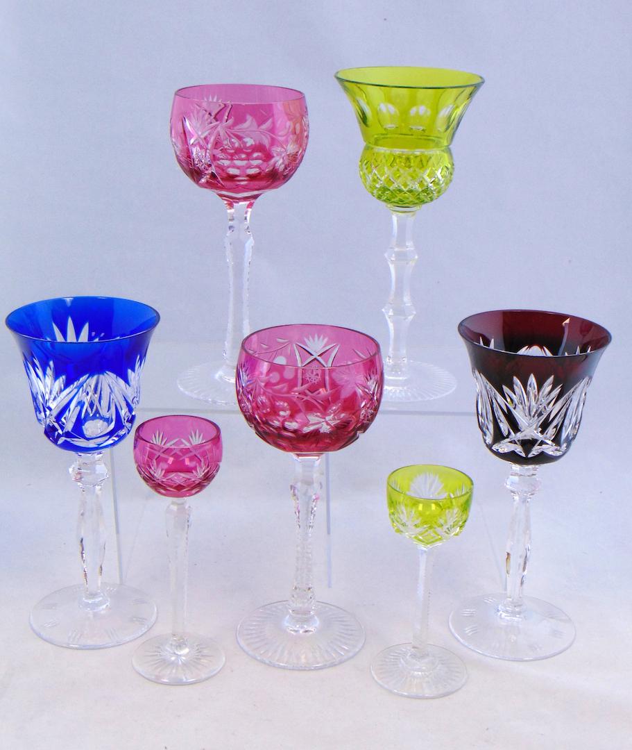 Group of cut to clear goblets: Including two cranberry wines in a grape pattern, a cobalt, Crimson, green, and two small cordials, 7 3/4" ht. Condition: good with no defects