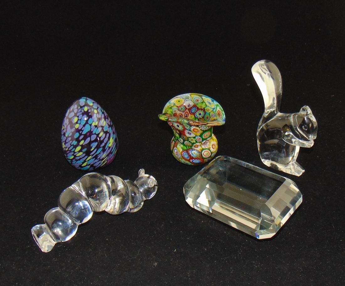 Group of cabinet glass items: Including a Millefiori toothpick, an art glass egg, a signed Baccarat squirrel, together with a caterpillar and a faceted paperweight. Tallest 4 3/4" ht. Condition: good with no defects found.
