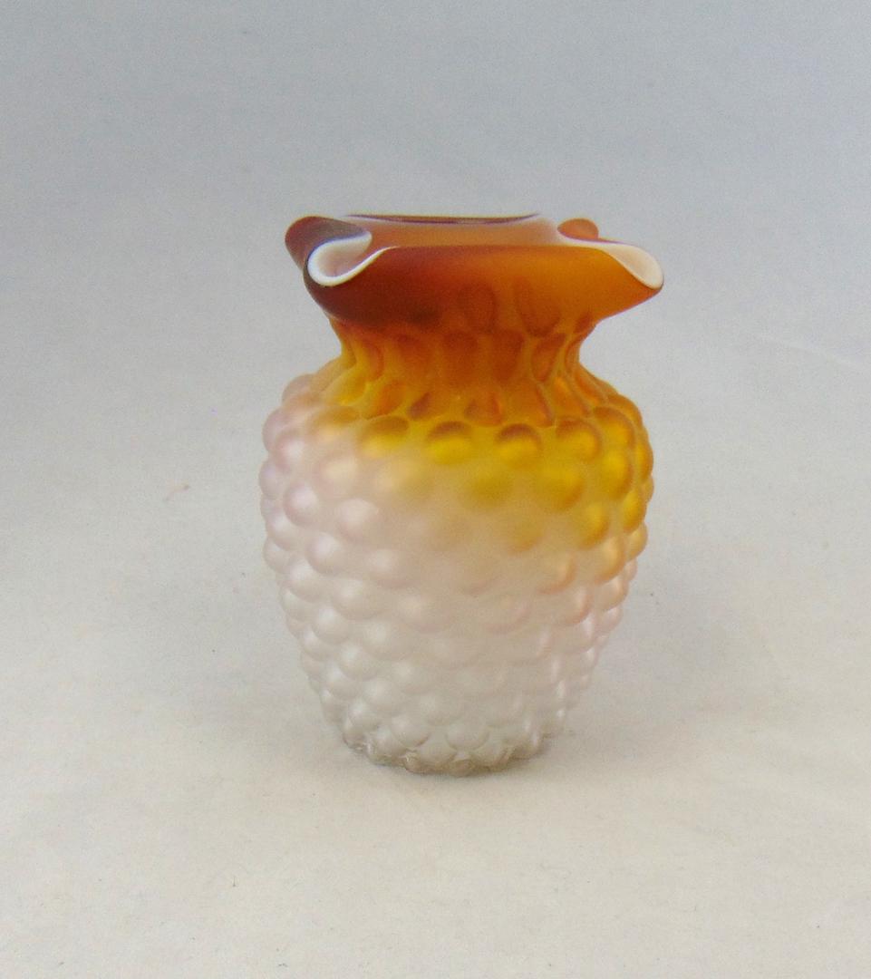 Caramel MOP satin glass vase: Shouldered form with a quad-ra-fold inverted rim in an exaggerated Hobnail, 5 1/2" ht. Condition: good with no defects found.