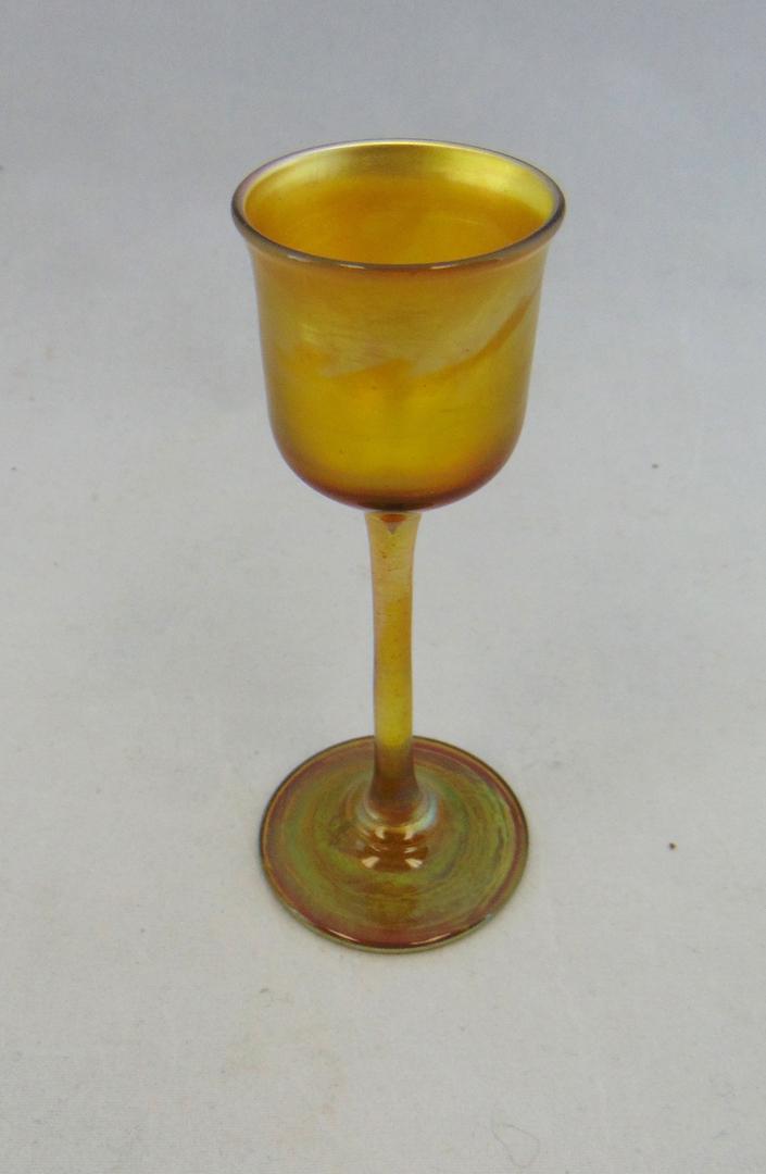 Tiffany gold Favrile glass cordial: Tiffany gold Favrile glass cordial, signed L C T Favrile, 4 1/2" ht. Condition: good with no defects found