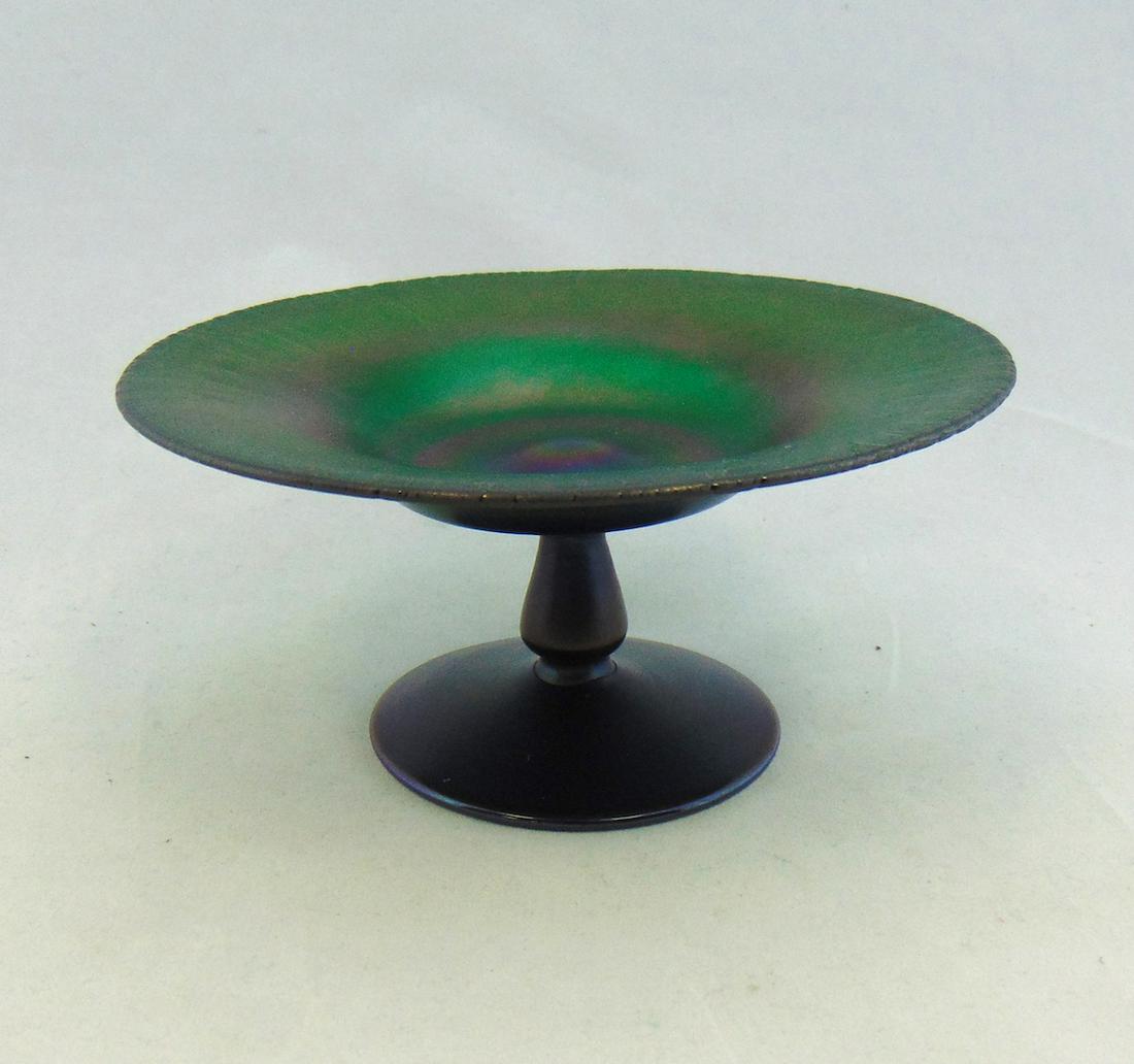 Quezal iridescent blue glass compote: Bluish green compote with a stretch border signed Quezal 3" ht by 5 3/4" wide. Condition: good with no defects found