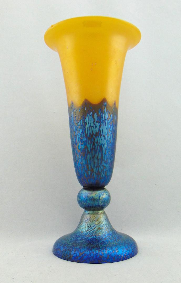 Loetz footed trumpet art glass vase: Lemon yellow trumpet form graduating from a cobalt Papillion foot, partial Czecho acid stamp, 9" ht. Reference https://loetz.com/decors-a-z/ausfuehrung/ausf-226 Condition: small chip to foot