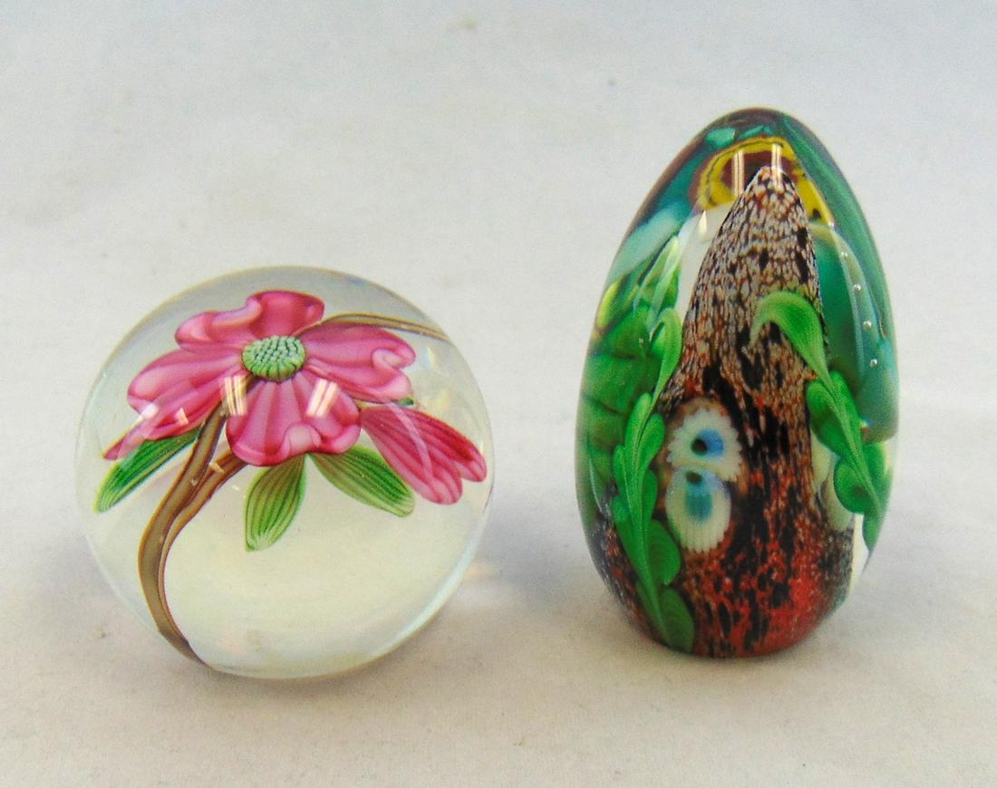 Two Orient and Flume paperweights: Including a round clear paperweight with pink flower, together with an egg form paperweight with underwater scene, both signed Orient and Flume, tallest 3" ht. Condition: good with no defects found.