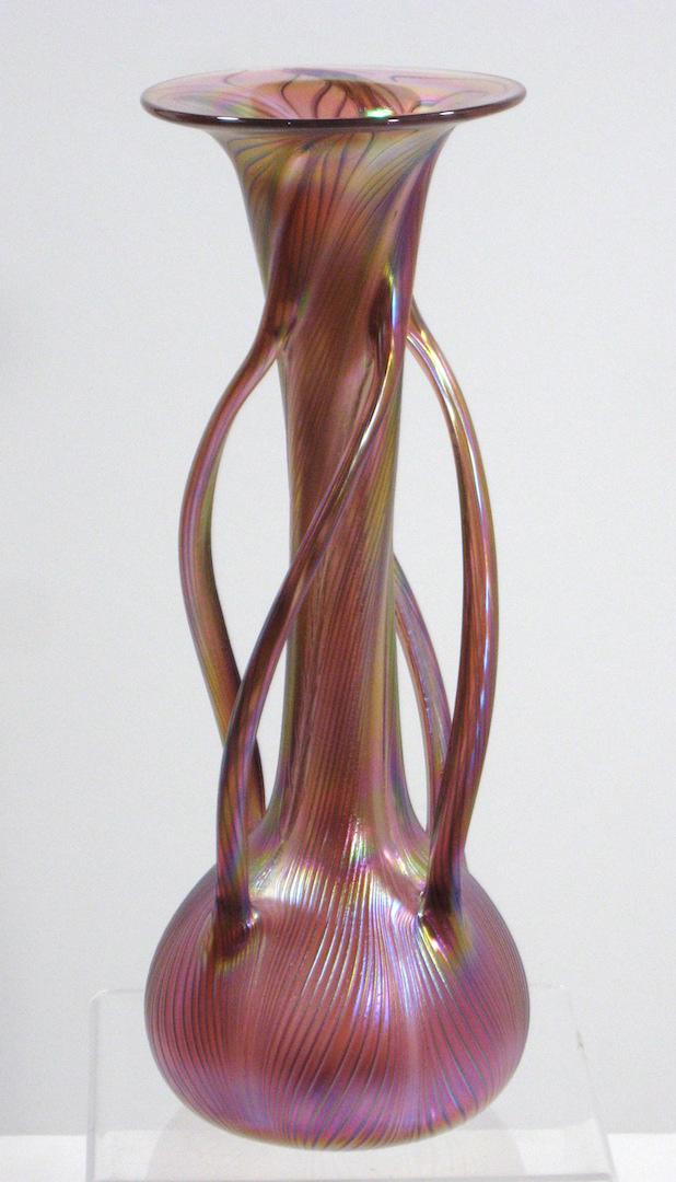 Czech contemporary art glass vase,: Bulbous trumpet form in red glass decorated with four twist side handles, 12" ht. Condition: good with no defects found.