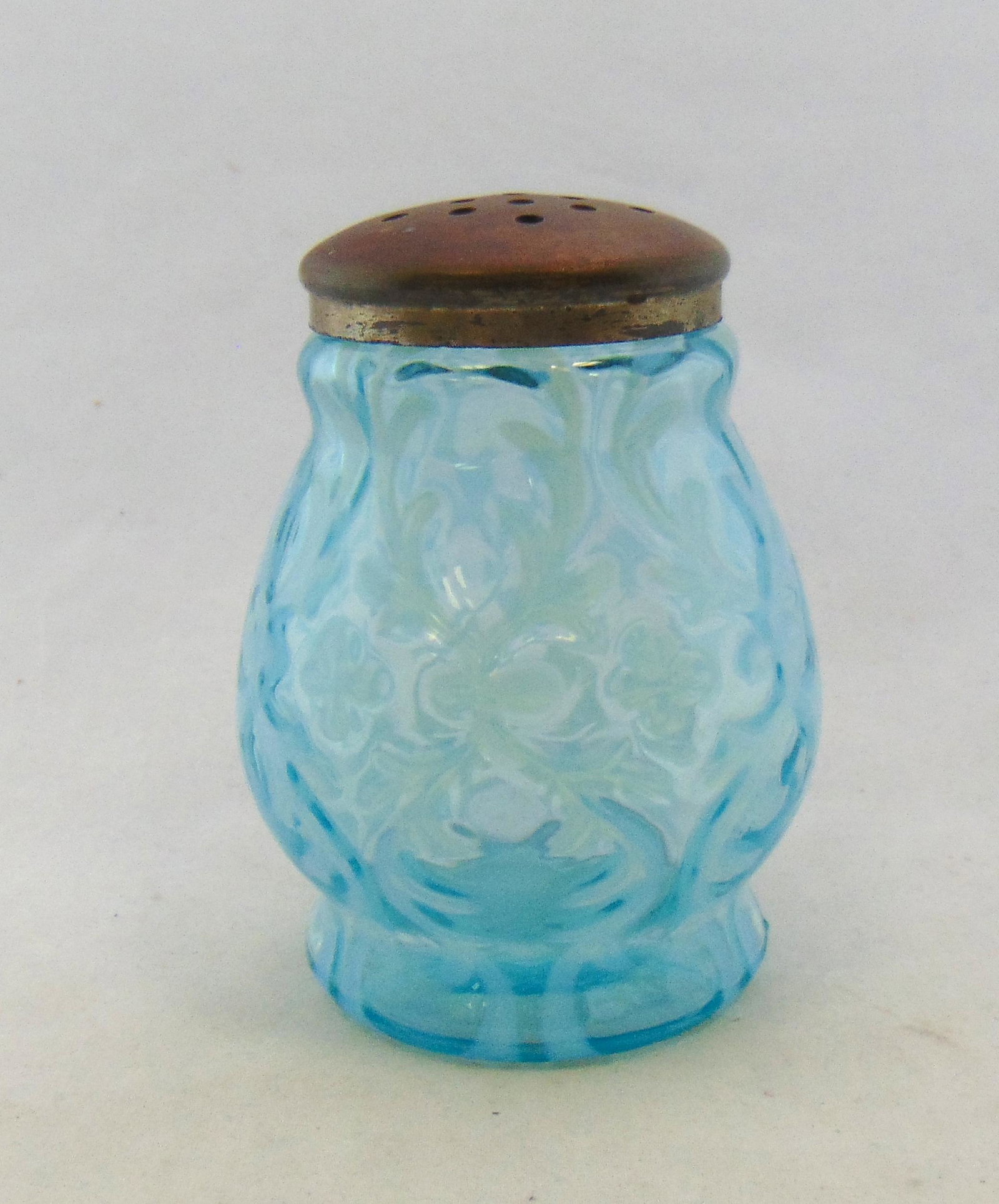 Northwood blue opalescent sugar shaker: Northwood Opaline Brocade/ Spanish Lace blue opalescent sugar shaker 4" ht. Condition: good, normal rough fitter