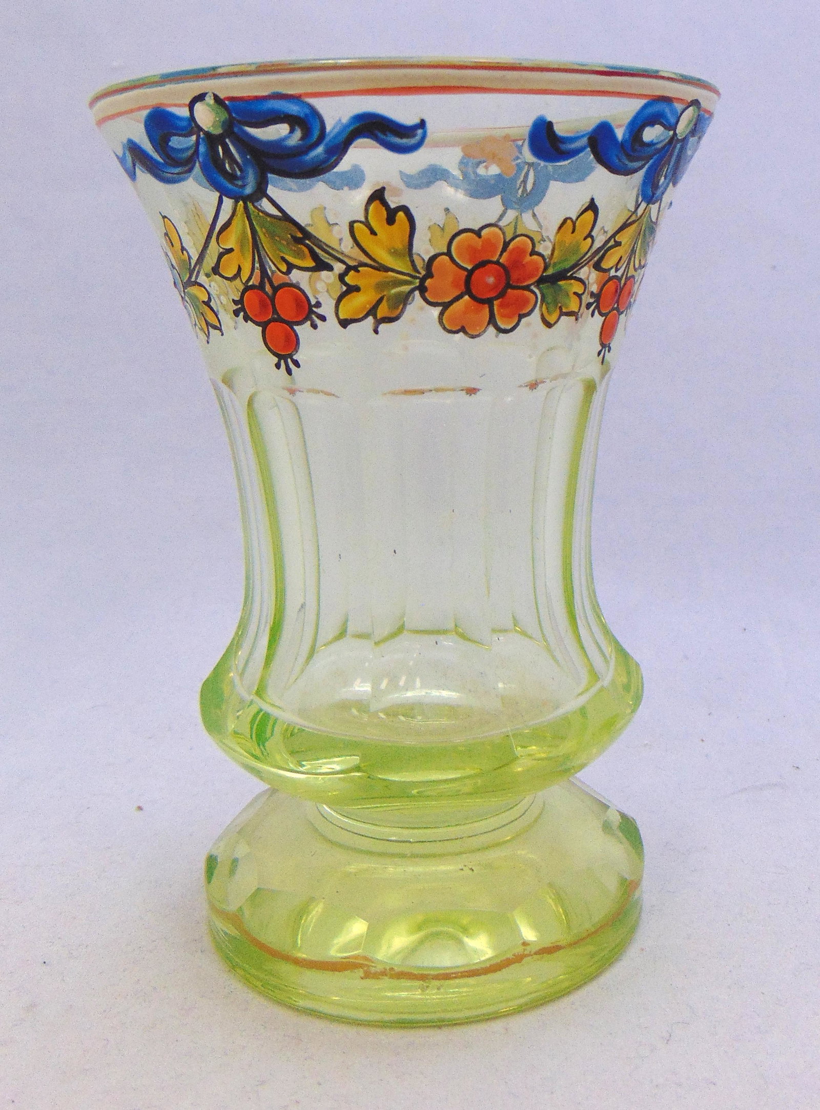 Vaseline footed goblet: Bohemian Vaseline footed goblet with polychrome enameled flowers and ribbons, 5 1/2" ht. Condition: good with no defects found.