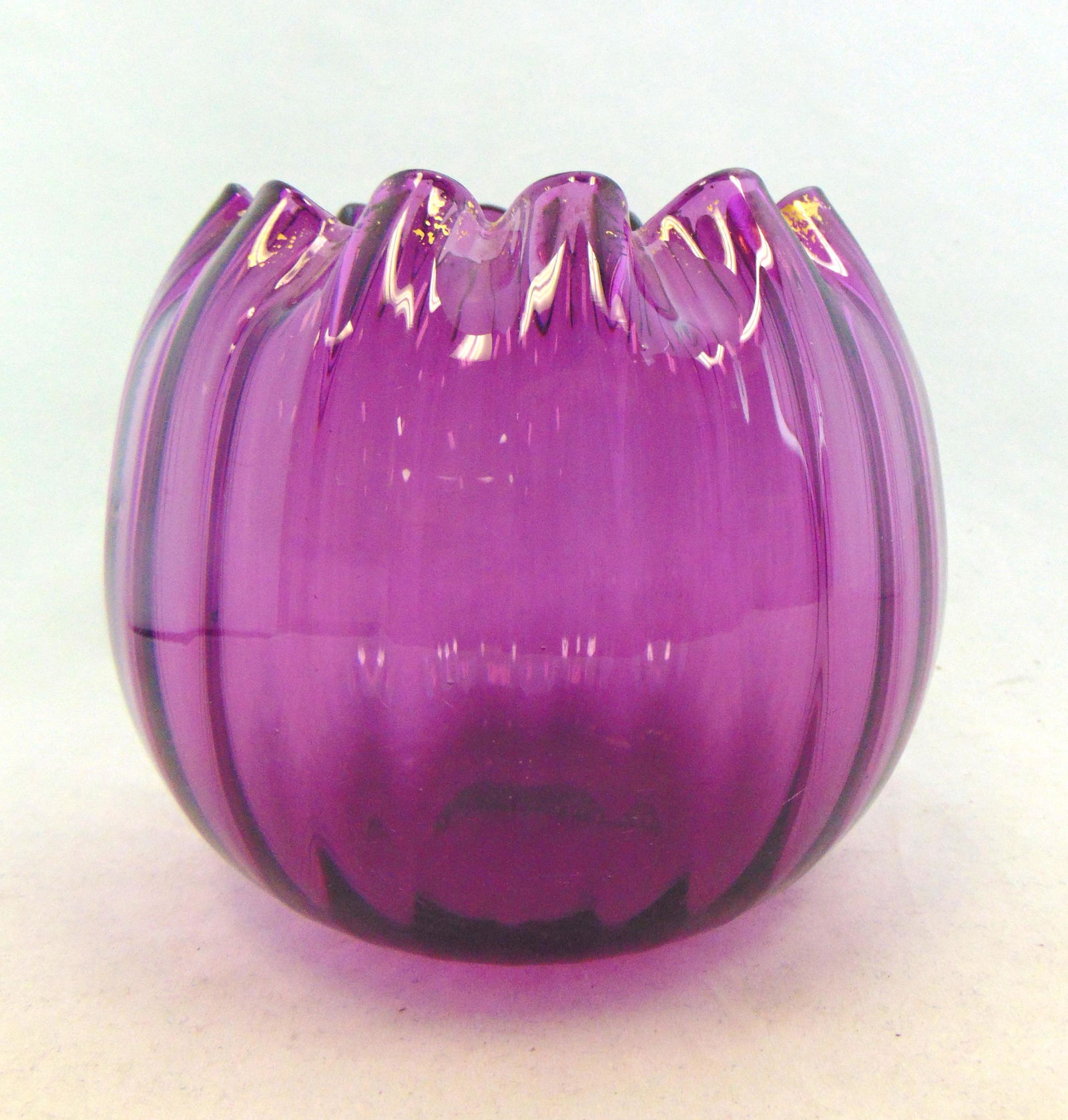Mont Joye ribbed rose bowl: Purple ribbed rose bowl with gold highlights, 5 1/2" ht. Condition: gold wear.