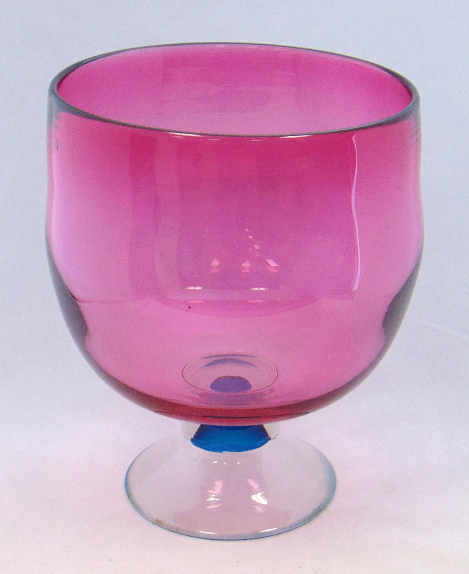 Richard Hornby art glass compote: Large cranberry table compote with a frosted and teal foot, signed Richard Hornby, 10" ht. Condition: good with no defects found.