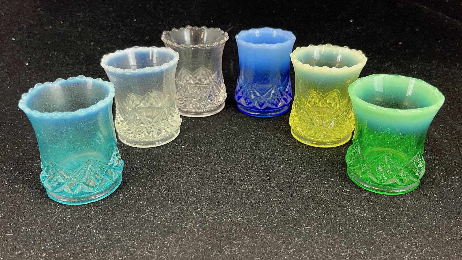 Diamond Spearhead toothpicks: Six Diamond Spearhead toothpicks by Northwood, 2 3/8" ht. Literature: Bredehofts/the Sanfords - Glass Toothpick Holders, Second Edition, p. 149. CONDITION: good with minor roughness.