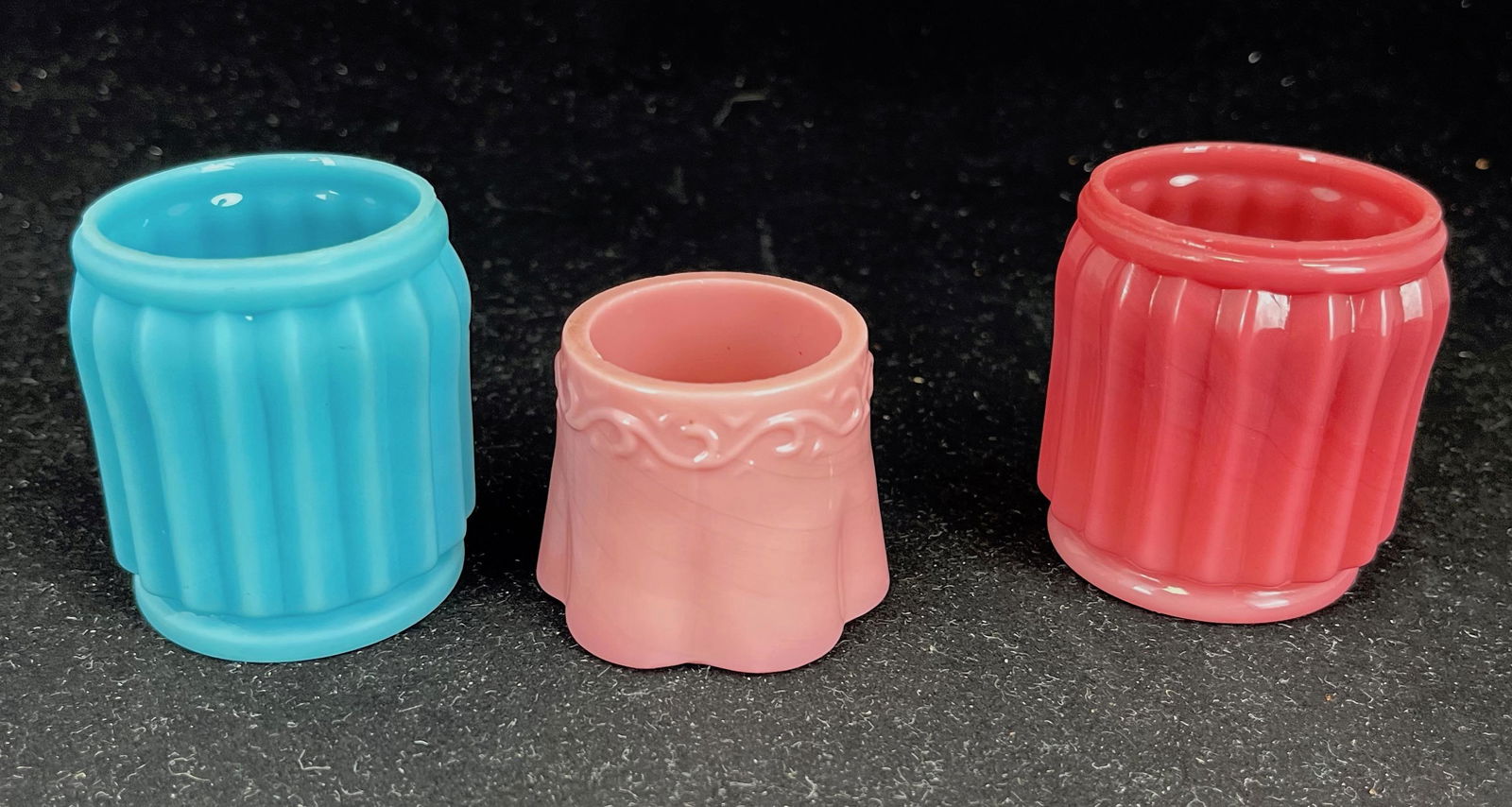 Three Opaque glass toothpicks: Three opaque glass toothpick including an Avon Little scrolled and a blue and pink Grecian Columns, tallest 2 1/4" ht. Literature: Bredehofts/the Sanfords - Glass Toothpick Holders, Second Edition, p.