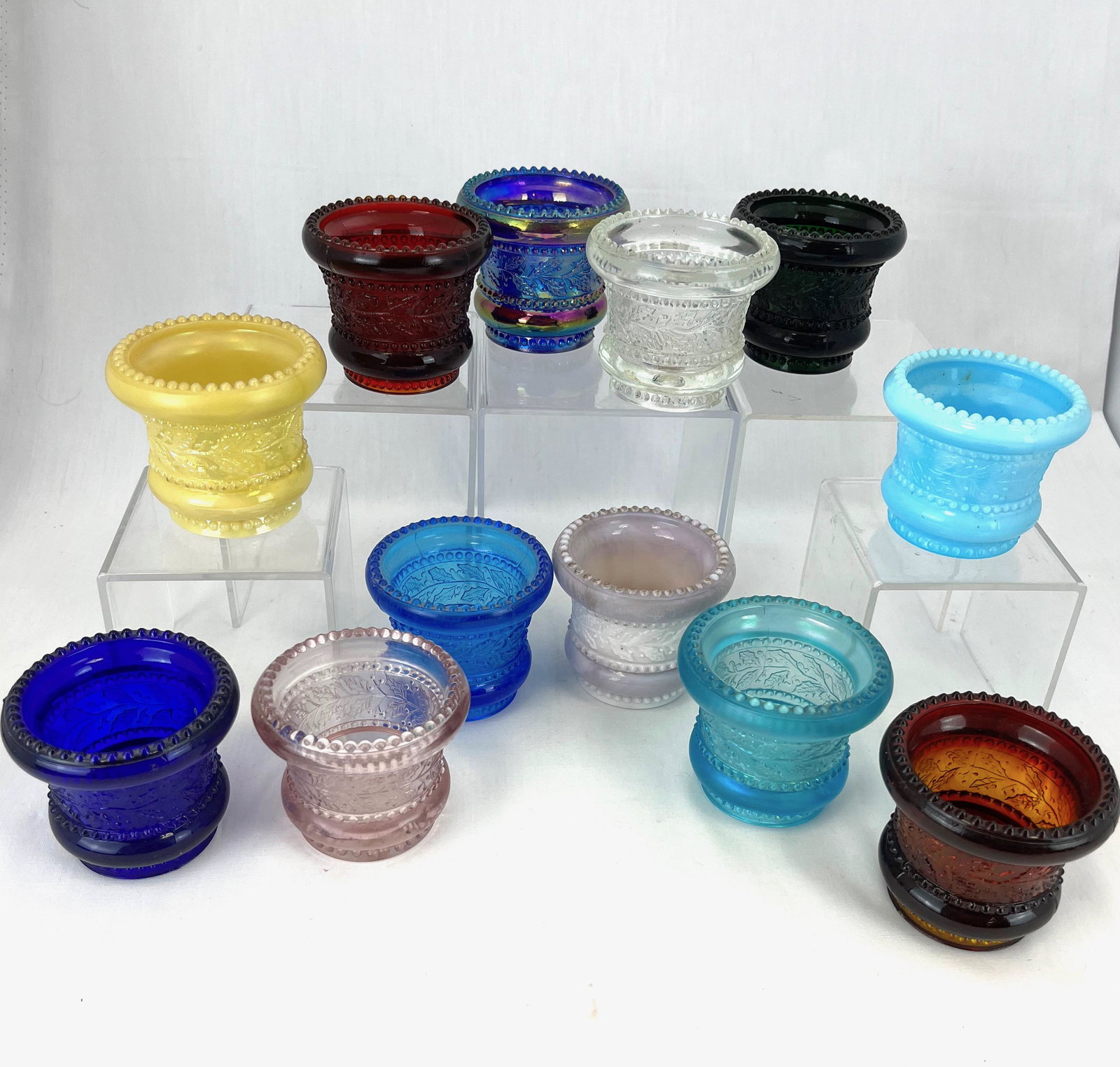 12 Holly pattern glass toothpicks: 12 Holly pattern glass toothpicks various colors and makers, 2 3/8" ht. CONDITION: minor wear