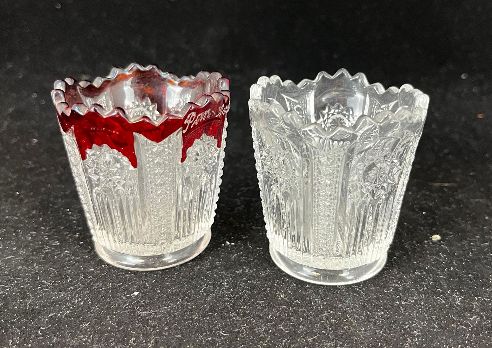 Two Prince Albert glass toothpicks: Two Prince Albert glass toothpicks including a clear and a ruby stained, Ruby Stained with script Pan American 1901, 2 3/8" ht. Literature: Bredehofts/the Sanfords - Glass Toothpick Holders, Second Ed