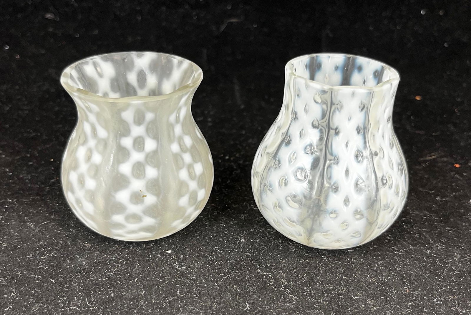 Two criss cross opalescent toothpicks: Two criss cross white opalescent toothpicks; including a Consolidated. 2 1/4" ht. Literature: Bredehofts/the Sanfords - Glass Toothpick Holders, Second Edition, p. 46. CONDITION: good with minor wear.
