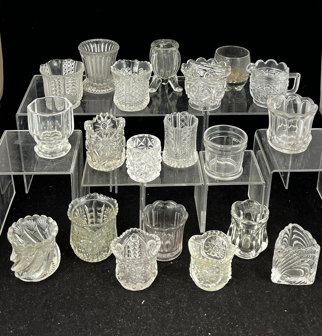 20 clear EAPG toothpicks: 20 clear EAPG toothpick holders various makers and patterns. CONDITION: good with minor wear