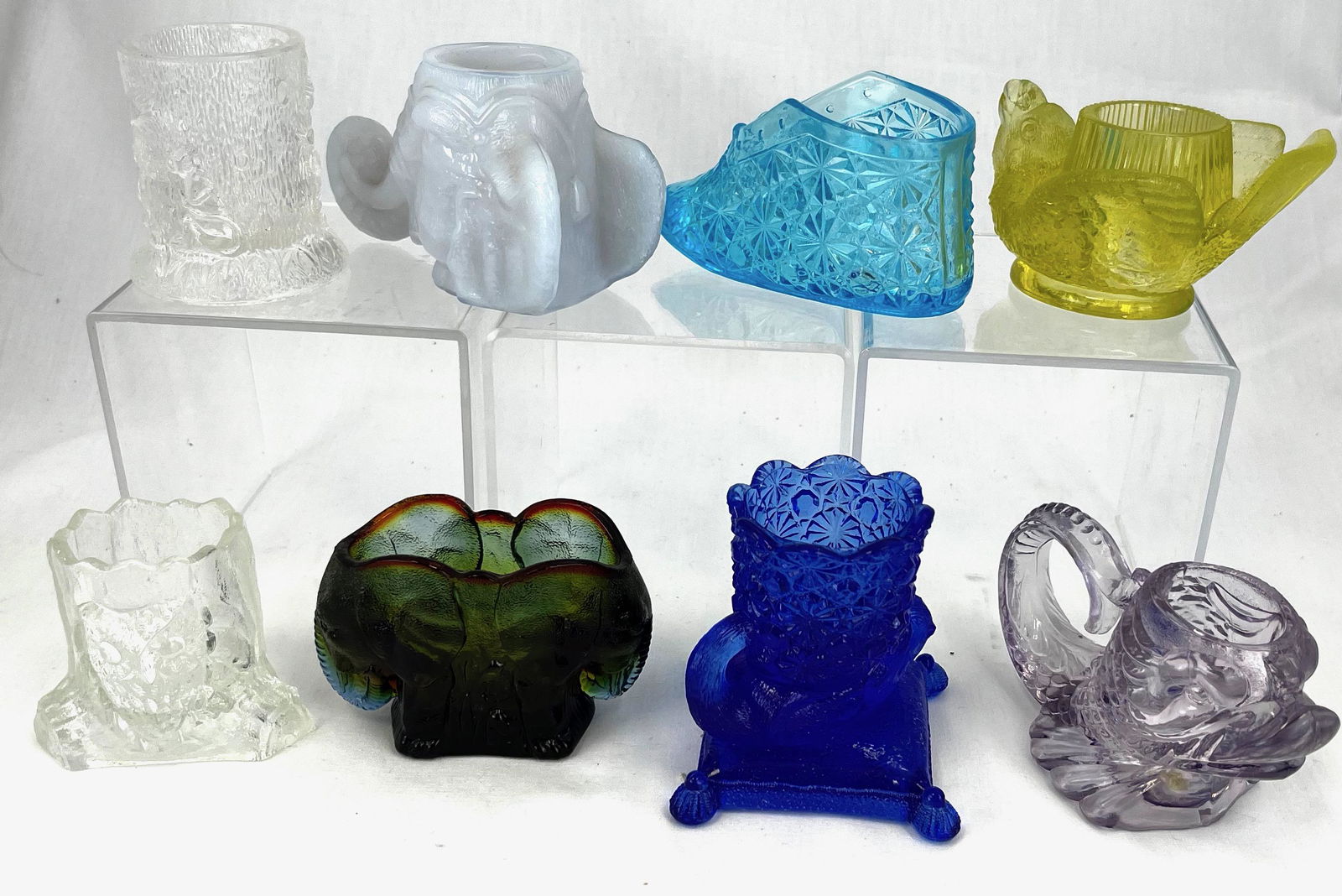 Eight Novelty toothpick holders: Eight Novelty toothpick holders, various makers, dates, and colors including a monkey on stump, an owl on stump, a baby bootie, a Boyd elephant, a Vaseline bird, a dolphin, and new cat on a pillow; CO