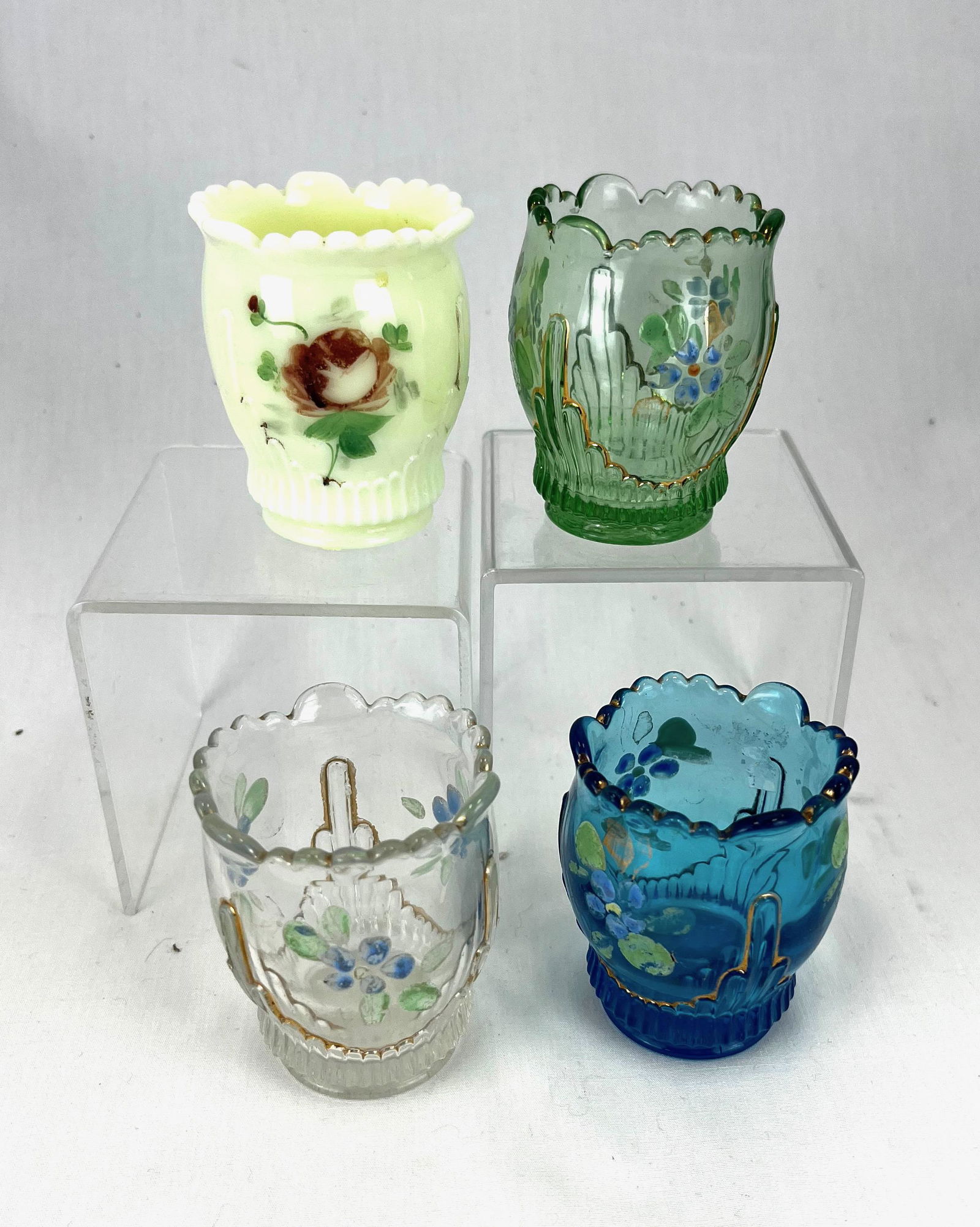 Four Ribbed Drape toothpick holders: Four Jefferson Ribbed Drape toothpick holders including one custard; 2.5" ht.; Literature: Bredehofts/the Sanfords - Glass Toothpick Holders, Second Edition, p. 113. CONDITION: good with minor wear.