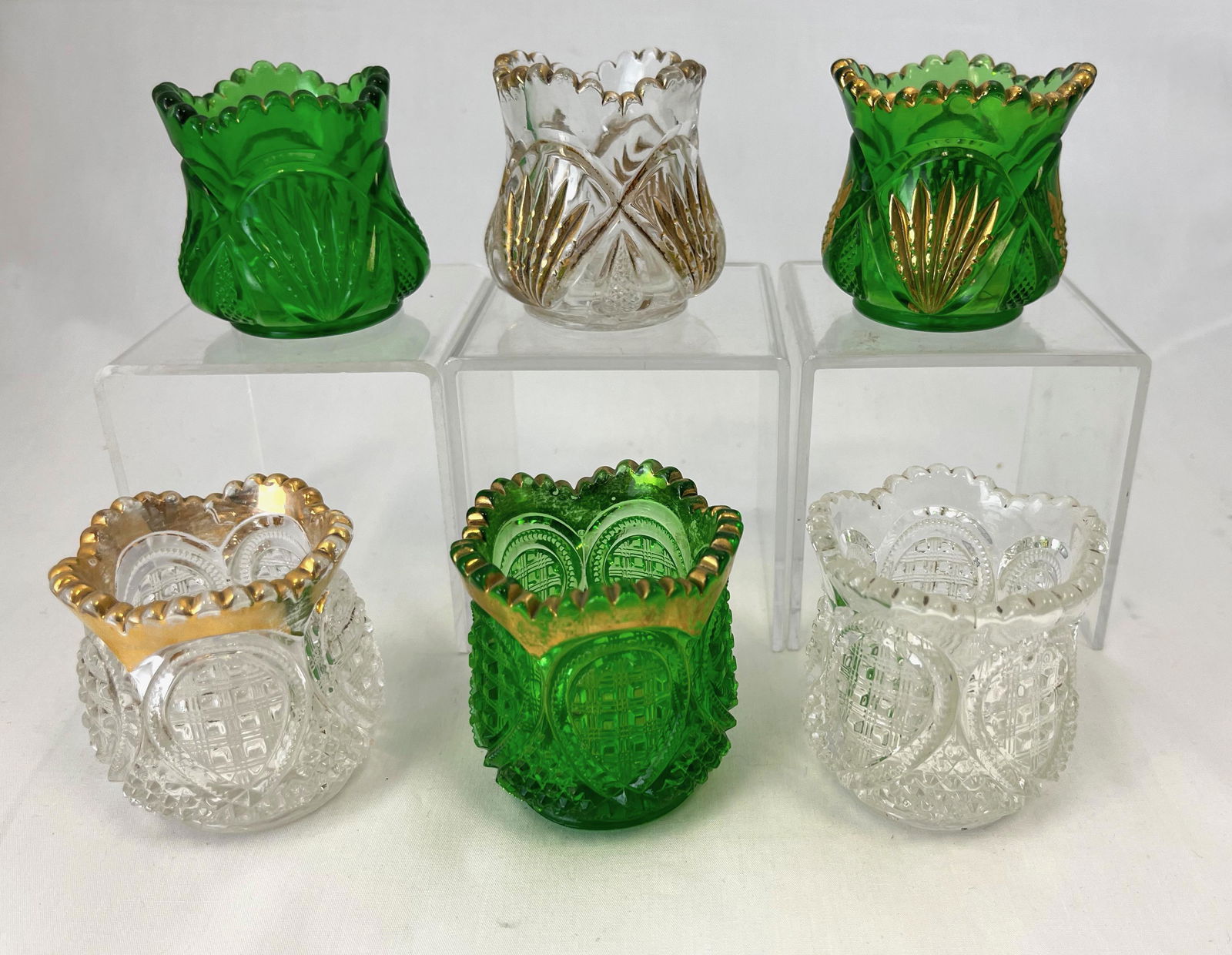 Six Heisey toothpick holders: Six Heisey toothpick holders including three Pineapple and Fan and two Fancy Loop, tallest 2 5/8"; Literature: Bredehofts/the Sanfords - Glass Toothpick Holders, Second Edition, p. 92 and 95. CONDITIO