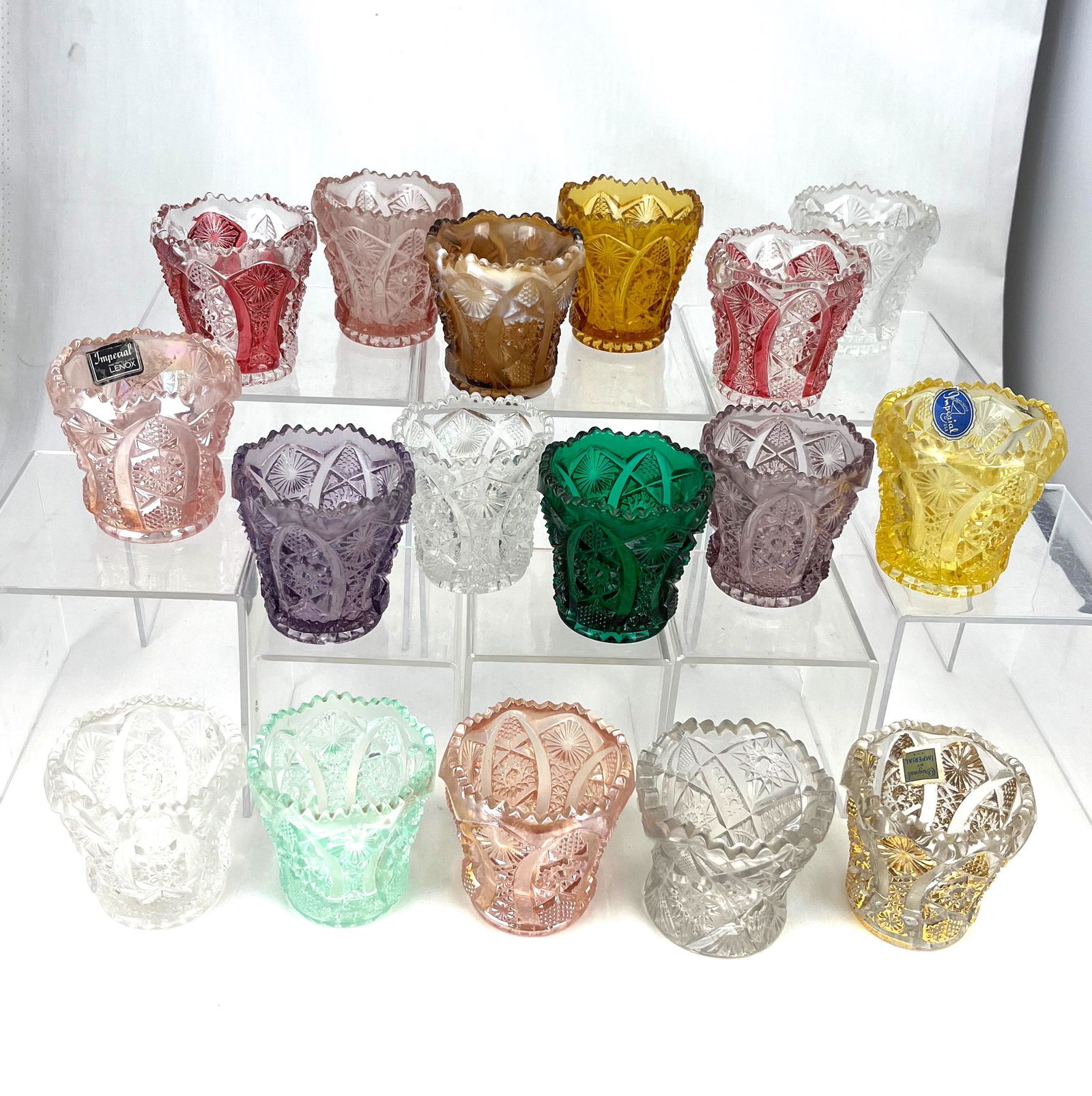 17 Imperial Octagon toothpick holders: 17 Imperial Octagon toothpick holders, various colors; 2.5" ht. Literature: Bredehofts/the Sanfords - Glass Toothpick Holders, Second Edition, p. 106. CONDITION: good with minor wear.