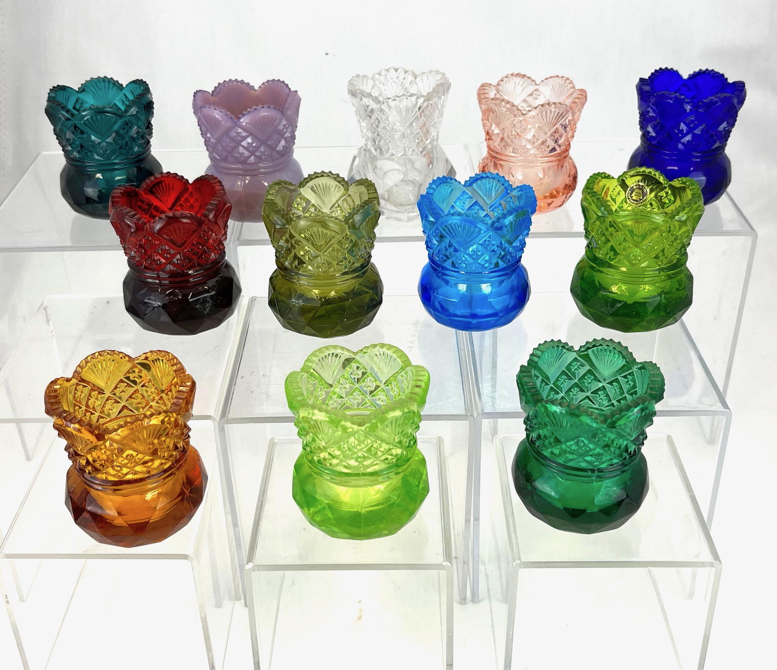 12 Diamond and Fan toothpicks: 12 Diamond and Fan toothpick holders, various colors including one emerald green with Westmoreland paper label; 2 3/8" ht. CONDITION: good with minor wear.