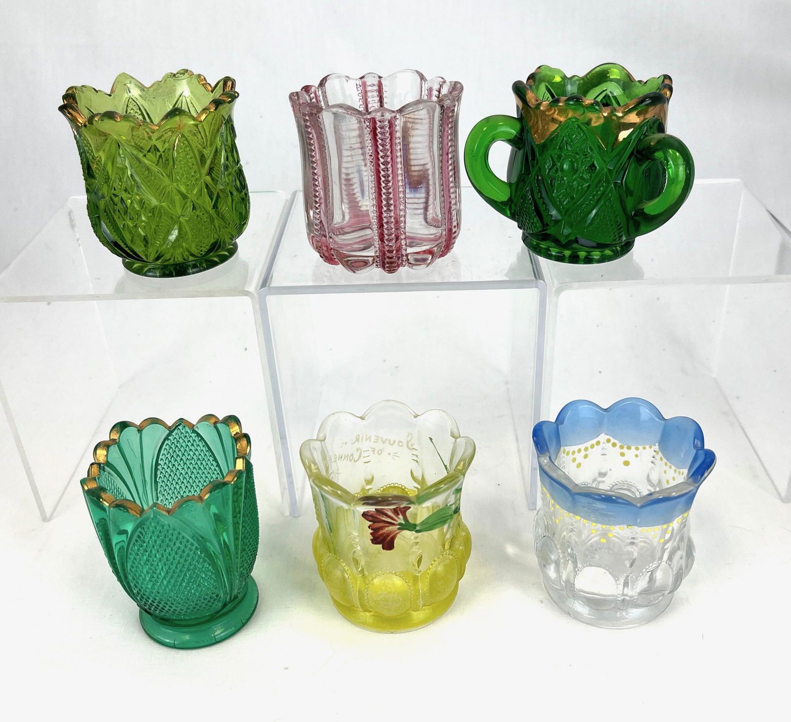 Group of six State toothpick holders: Group of six State toothpick holders including a blue and yellow flashed Michigan, a ruby flashed Iowa, a green Kentucky with gold rim, a green Pennsylvania with gold rim, and emerald three handled Mi