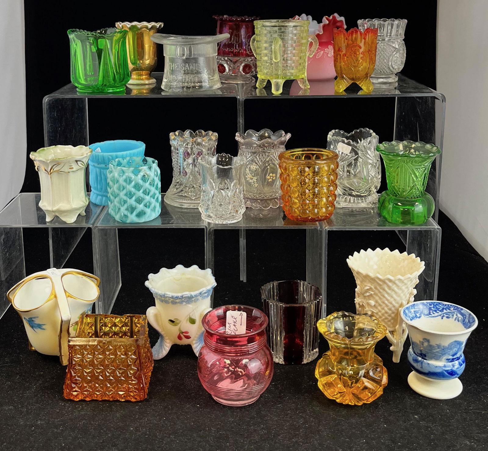 25 damaged EAPG toothpicks: 25 damaged EAPG toothpick holders, various colors and makers; each presentable but with chips, cracks or other loss.