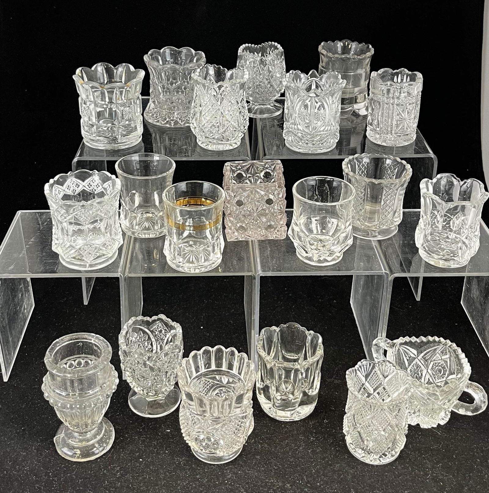 20 EAPG clear assorted toothpicks: 20 assorted clear toothpick holders various makers and patterns; tallest 3 1/4"; CONDITION: good with minor wear