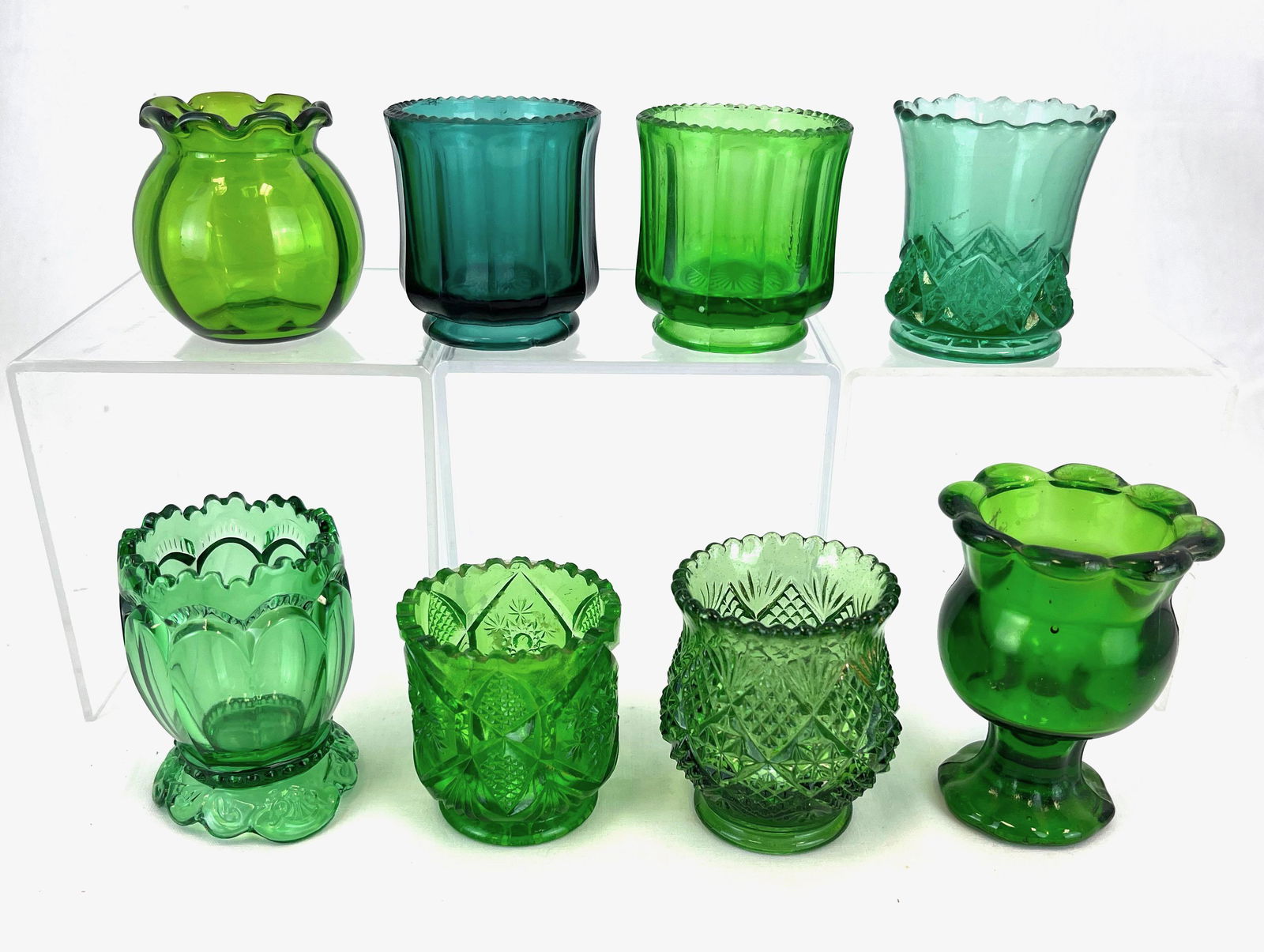 Eight EAPG green toothpicks: Eight EAPG green toothpick holders various makers, patterns include Fish Bowl, Empress, Diamond Spearhead, Fernland, Colonial, and Model Peerless; tallest 3 1/4". CONDITION: good with minor wear