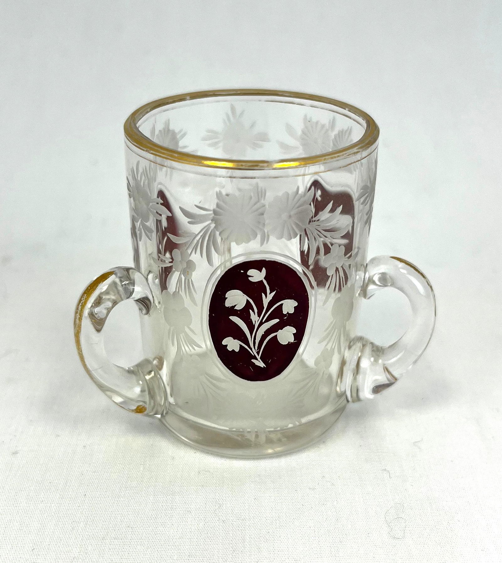 French three handled toothpick: French three handled toothpick holder, with etched medallion, 2 1/4" ht. CONDITION: good but with a small pin prick to rim.