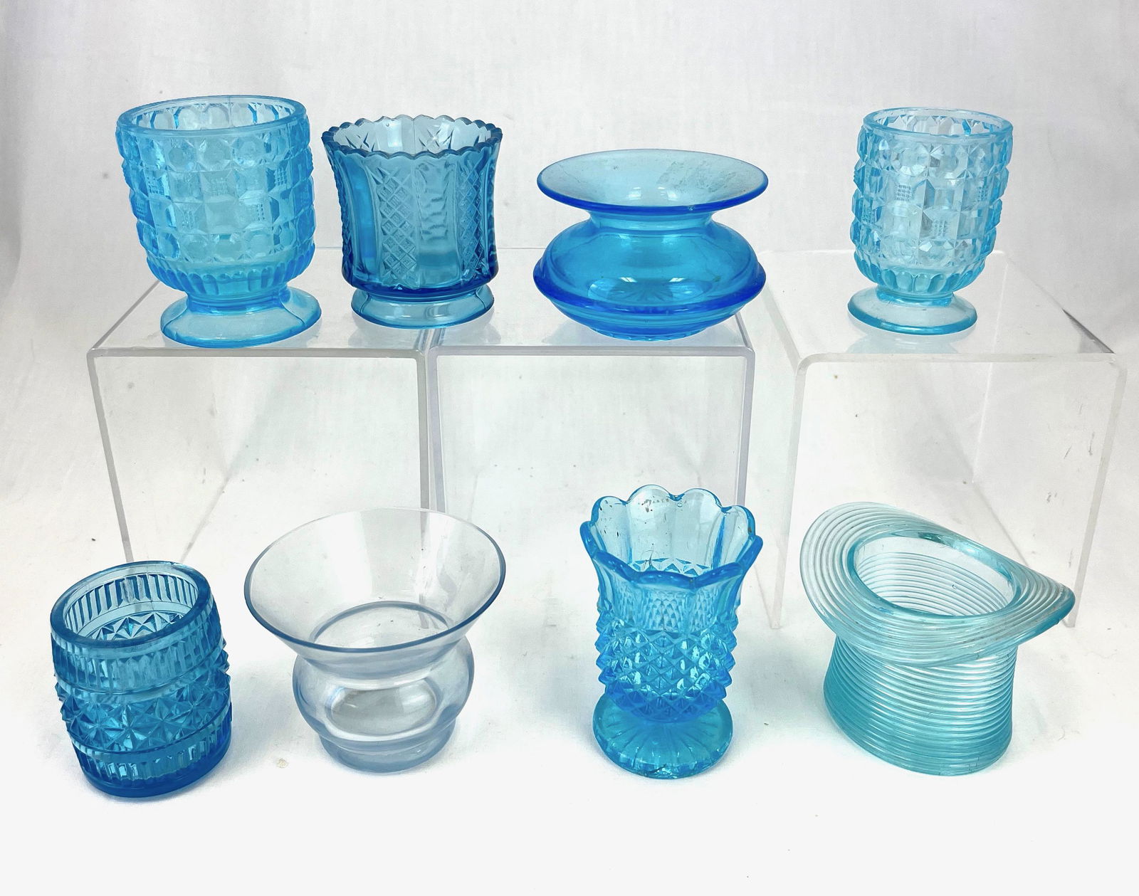 Eight EAPG toothpick holders: Eight blue EAPG toothpick holders, various makers and patterns including Butler Brothers Cuspidor, Pette Point Pedestal, Plug Hat, Diamond Panel, Cambridge Blue Urn, and Blue Tappan; tallest 2 7/8"; C