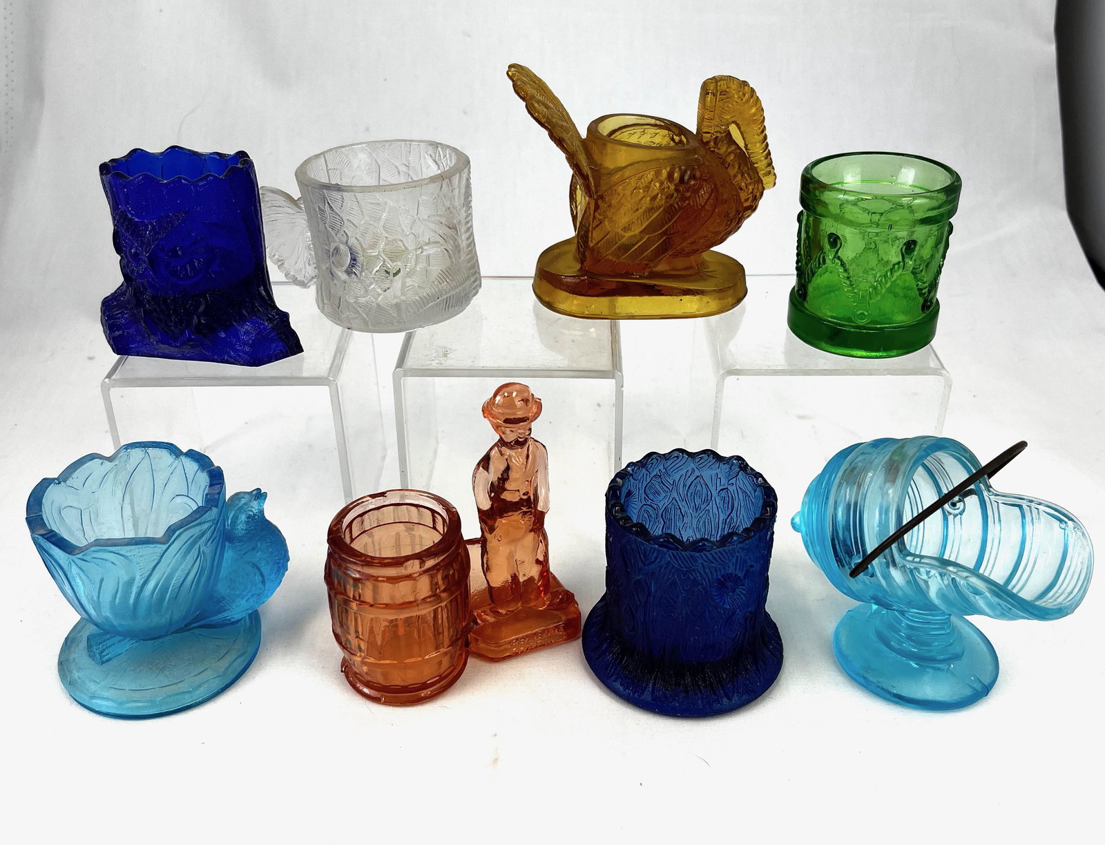 Eight Novelty toothpick holders: Eight Novelty toothpick holders various makers, patterns, and colors including an Amber Turkey, a clear Fish Cup, Cobalt Owl on Stump, green Drum, blue Bird on Basket, blue Coal Scuttle with wire hand
