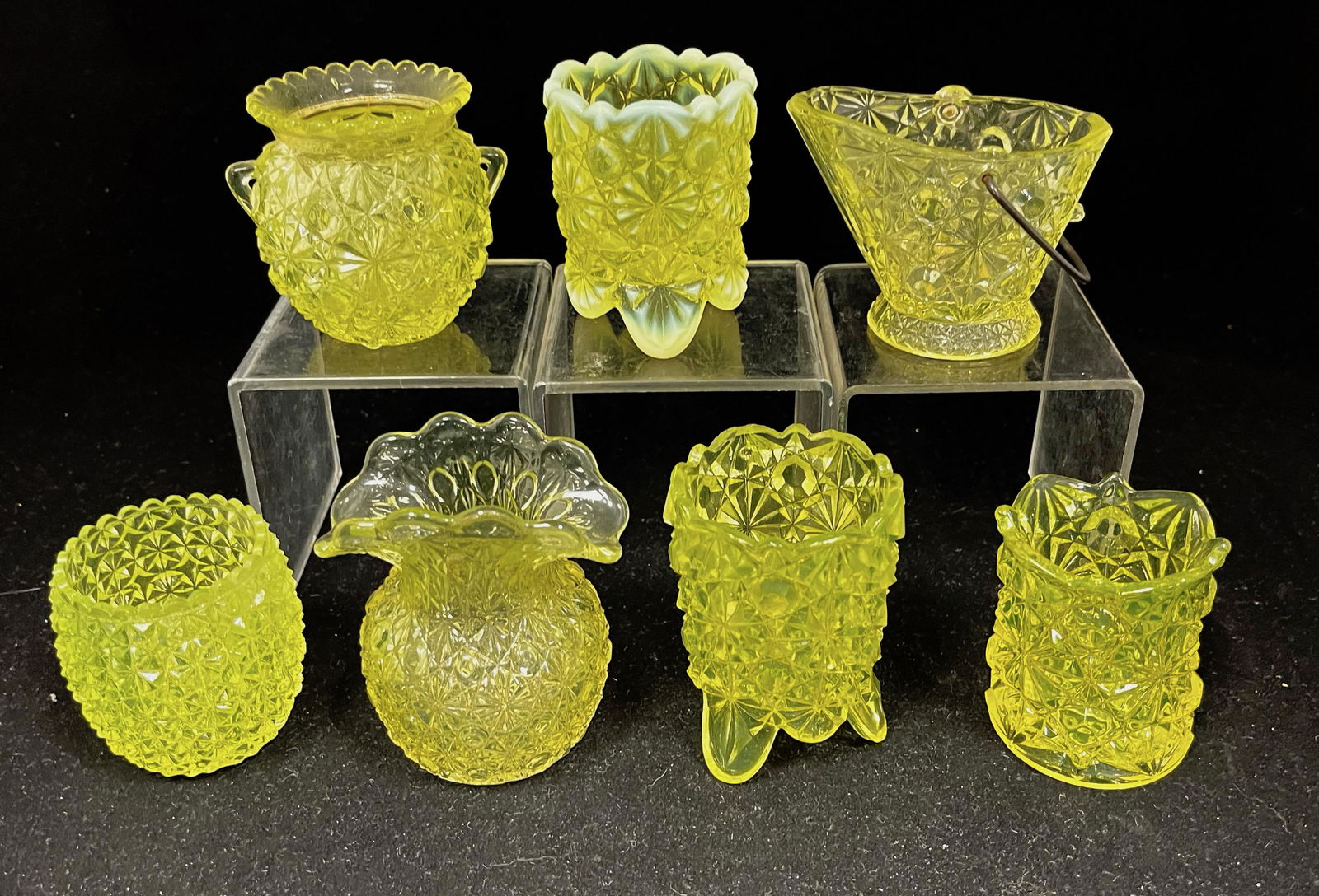 Seven Vaseline toothpicks: Seven Vaseline Daisy & Button toothpick holders, various shapes including a coal skuttle with handle; tallest 3". CONDITION: good with minor wear.