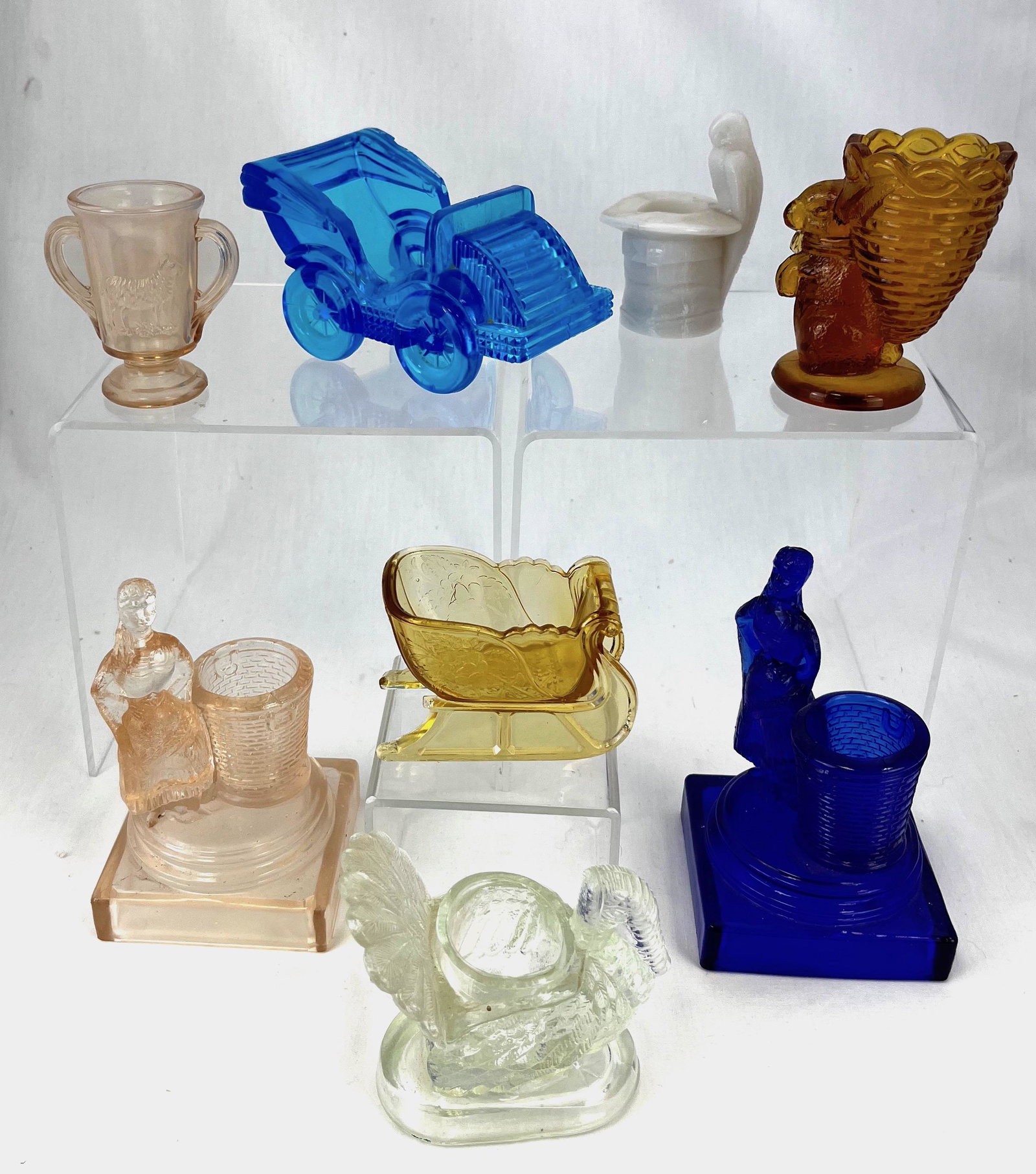 Eight figural Novelty toothpicks: Eight figural Novelty toothpick holders various makers and patterns and colors including an amber sleigh, cobalt Pretty Maiden, pink Pretty Maiden, clear Turkey, blue car, pink Loving Cup with Lamb, a