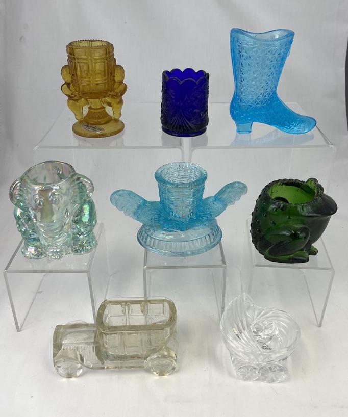 Group of eight Novelty toothpicks: Group of eight Novelty toothpick holders various makers, patterns and colors including a blue Fine cut ladies boot, a crystal baby buggy, a crystal VCC Co car, an iridescent elephant, a green toad, an
