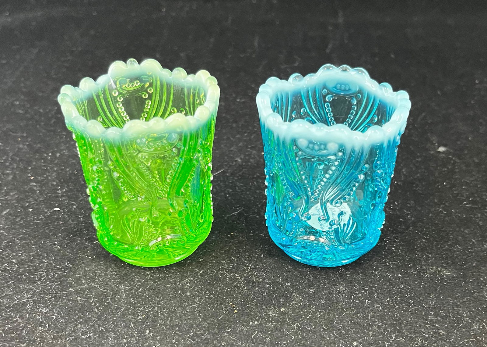 Two rare Jefferson Idyll toothpicks: Two rare Jefferson Idyll toothpick holders one blue opalescent, one green opalescent 2.5" ht. Literature: Bredehofts/the Sanfords - Glass Toothpick Holders, Second Edition, p. 218. CONDITION: no defec
