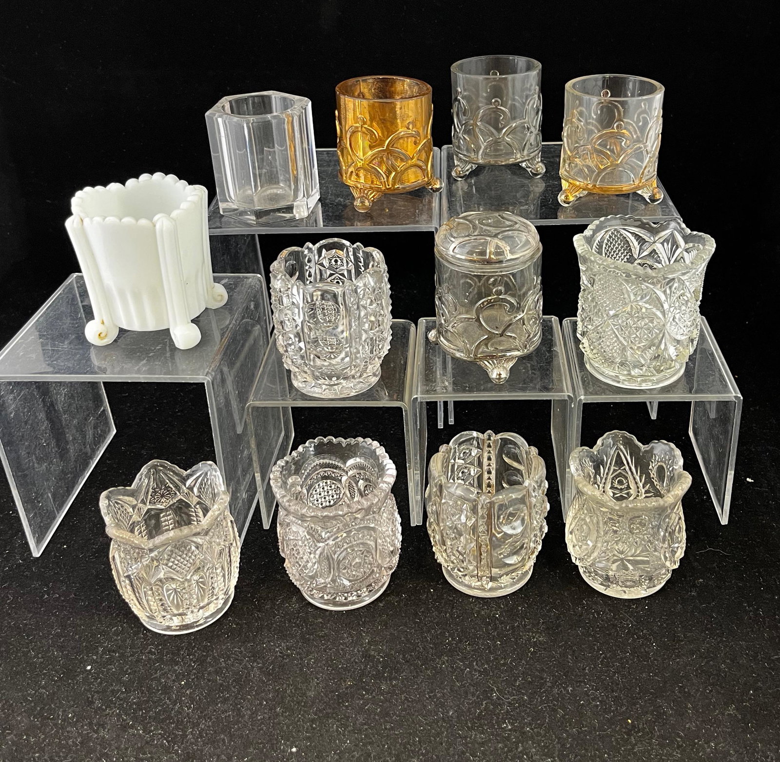 12 EAPG toothpick holders: 12 EAPG Westmoreland toothpick holders various patterns, mostly Chrystal including a Big Wheel, a Millard's Atlanta, a Late Westmoreland No 98, two Columned Thumbprint, Colonial, four Filigree/Capitol